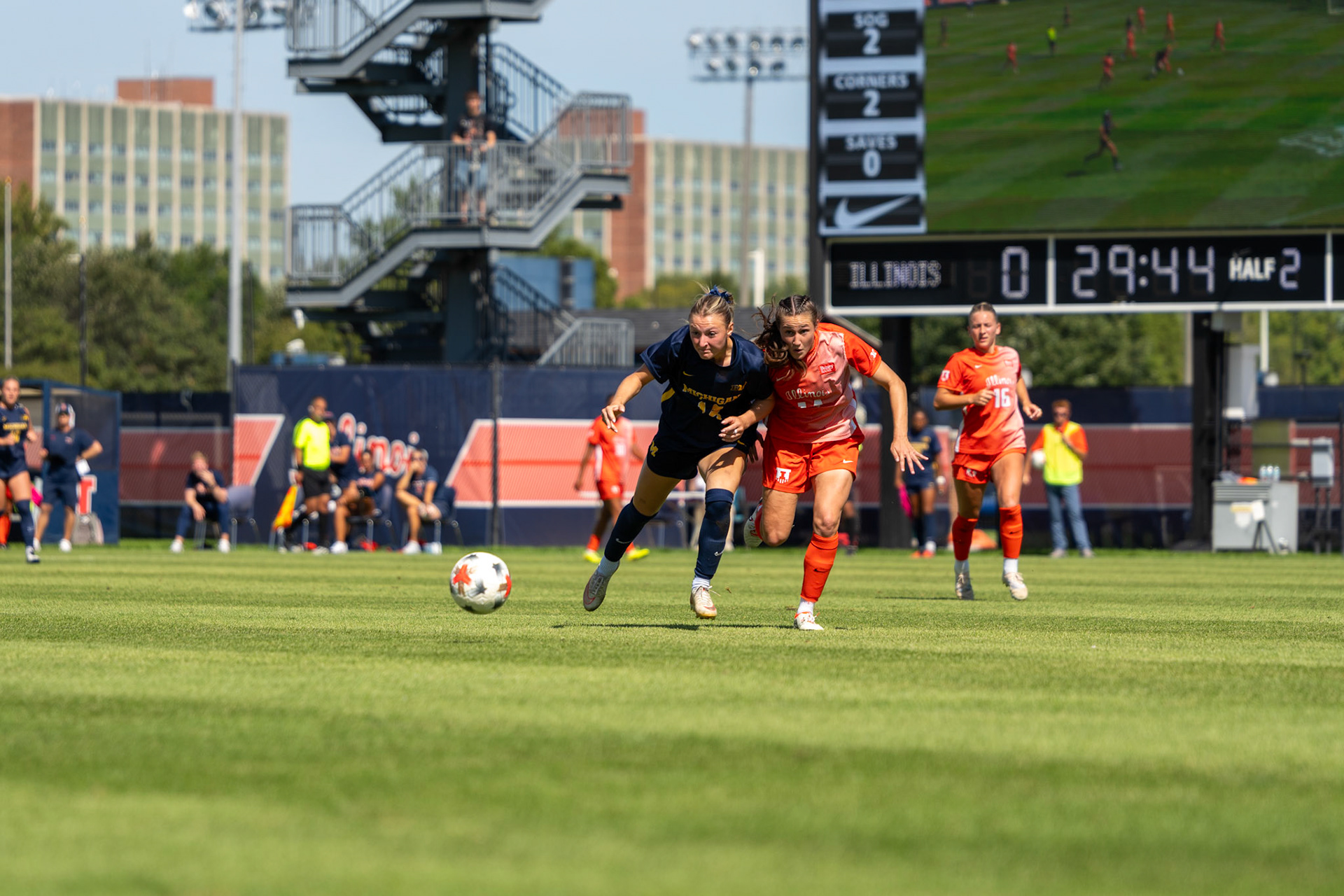 Bella Zanoni, junior defender, battles Michigan forward Ella Jablinskey for possession at Demirjian Park on Sunday. Illinois fell to Michigan 2-0 in the Big Ten contest.