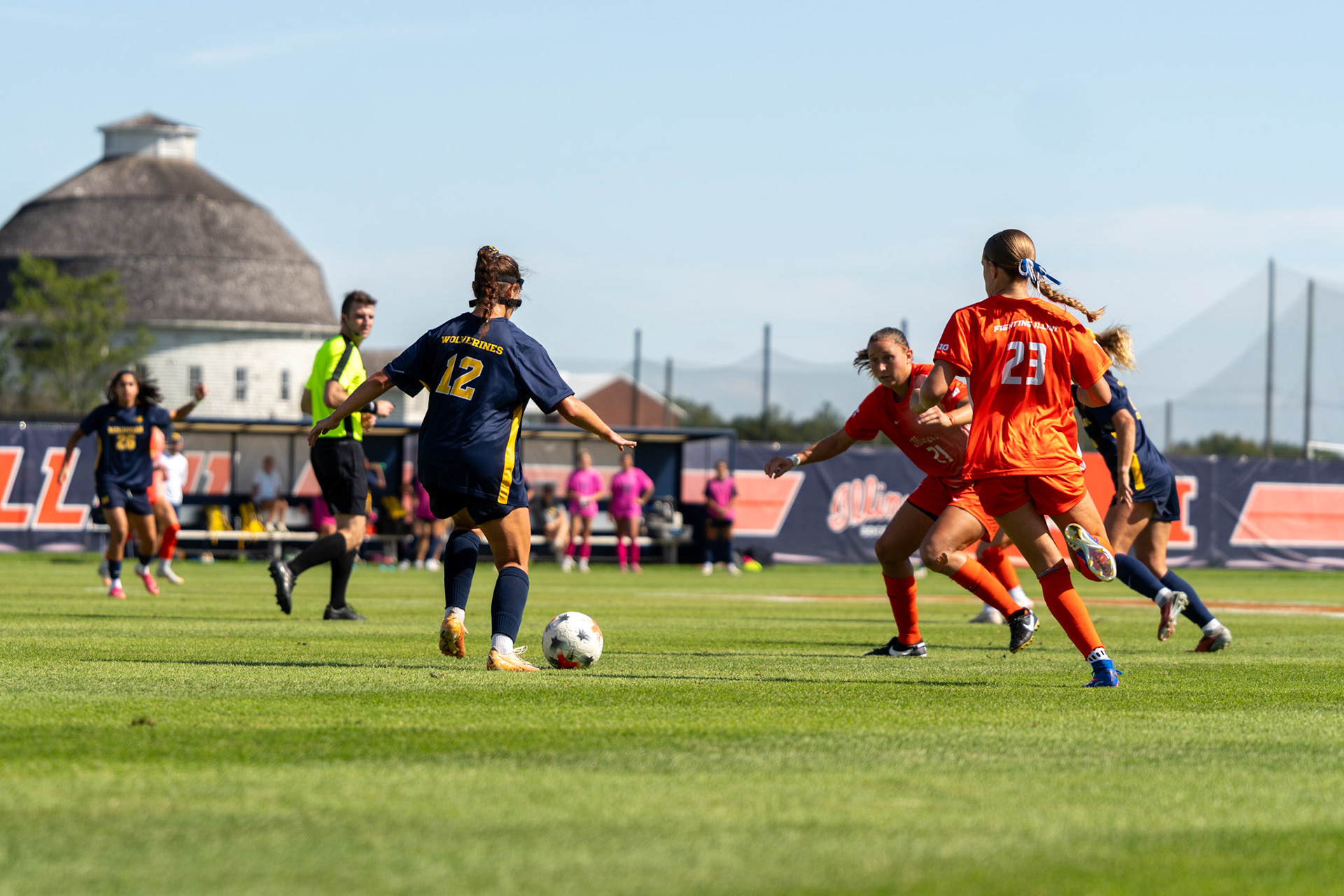 Michigan midfielder Rylie McKinney attempts to get past Illinois midfielder Myra Schneider and forward Ashlyn Adams at Demirjian Park on Sunday. The Wolverines defeated Illinois 2-0 in the Big Ten matchup.