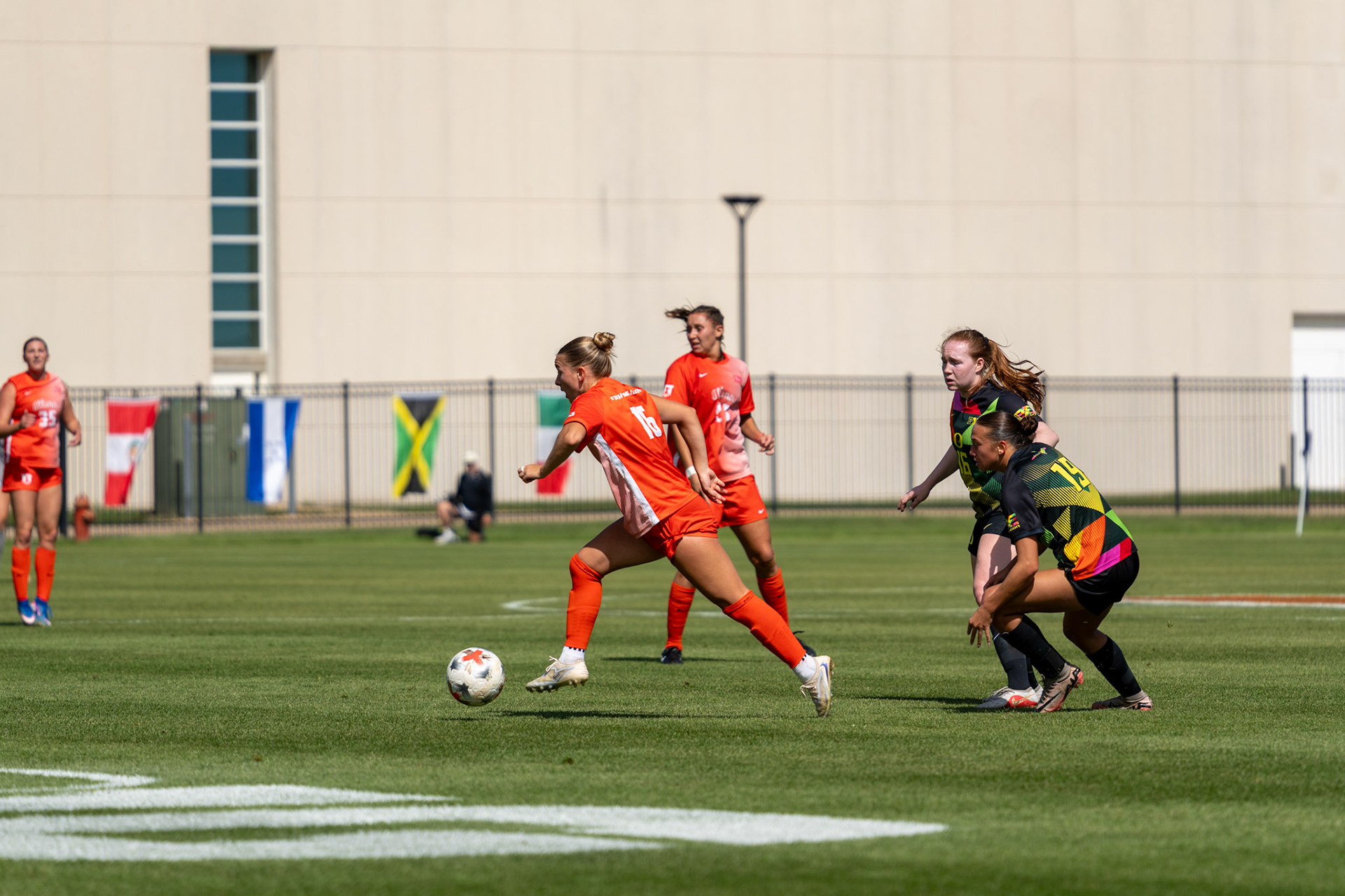 Ashley Stellon, fifth-year midfielder, pushes the ball up the field against Oregon at Demirjian Park on Sunday. Stellon recorded an assist on Ashleigh Vizek's goal in the 54th minute of Illinois' 2-0 victory.