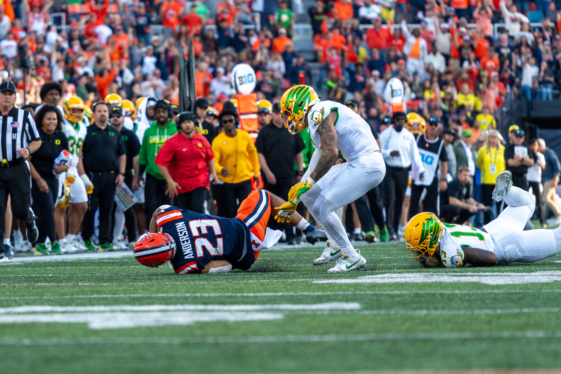 Jordan Anderson, fifth-year running back, is brought down by Oregon defenders after a big gain at Gies Memorial Stadium on Oct. 24, 2026. Anderson rushed 11 times for 67 yards in Illinois’ 21-10 victory over the Ducks.