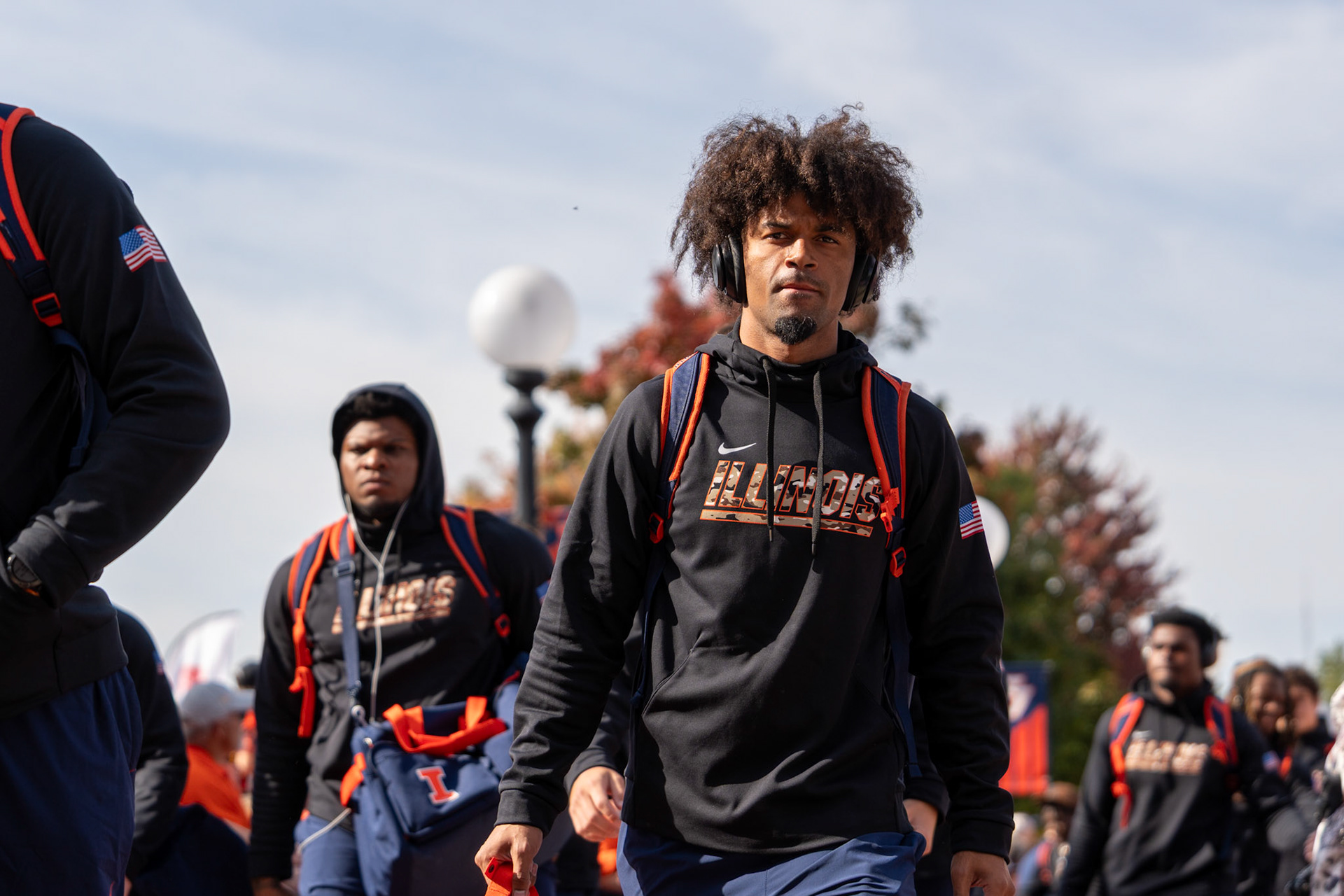 Illinois players walk through Grange Grove during the Illini Walk before their game against Oregon at Gies Memorial Stadium on Oct. 24, 2026. The Illini defeated the Ducks 21-10 in front of 58,723 fans.