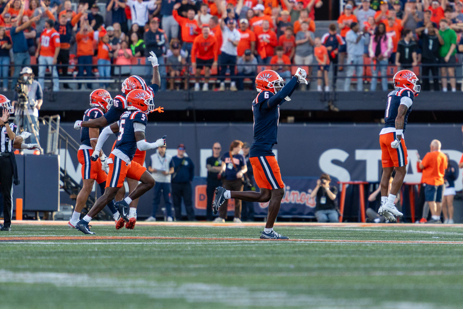 Illinois players celebrate after Oregon kicker Gage Hurych missed his second field goal of the game at Gies Memorial Stadium on Oct. 24, 2026. Hurych, who had been perfect before the contest, missed three of four attempts as the Illini won 21-10.