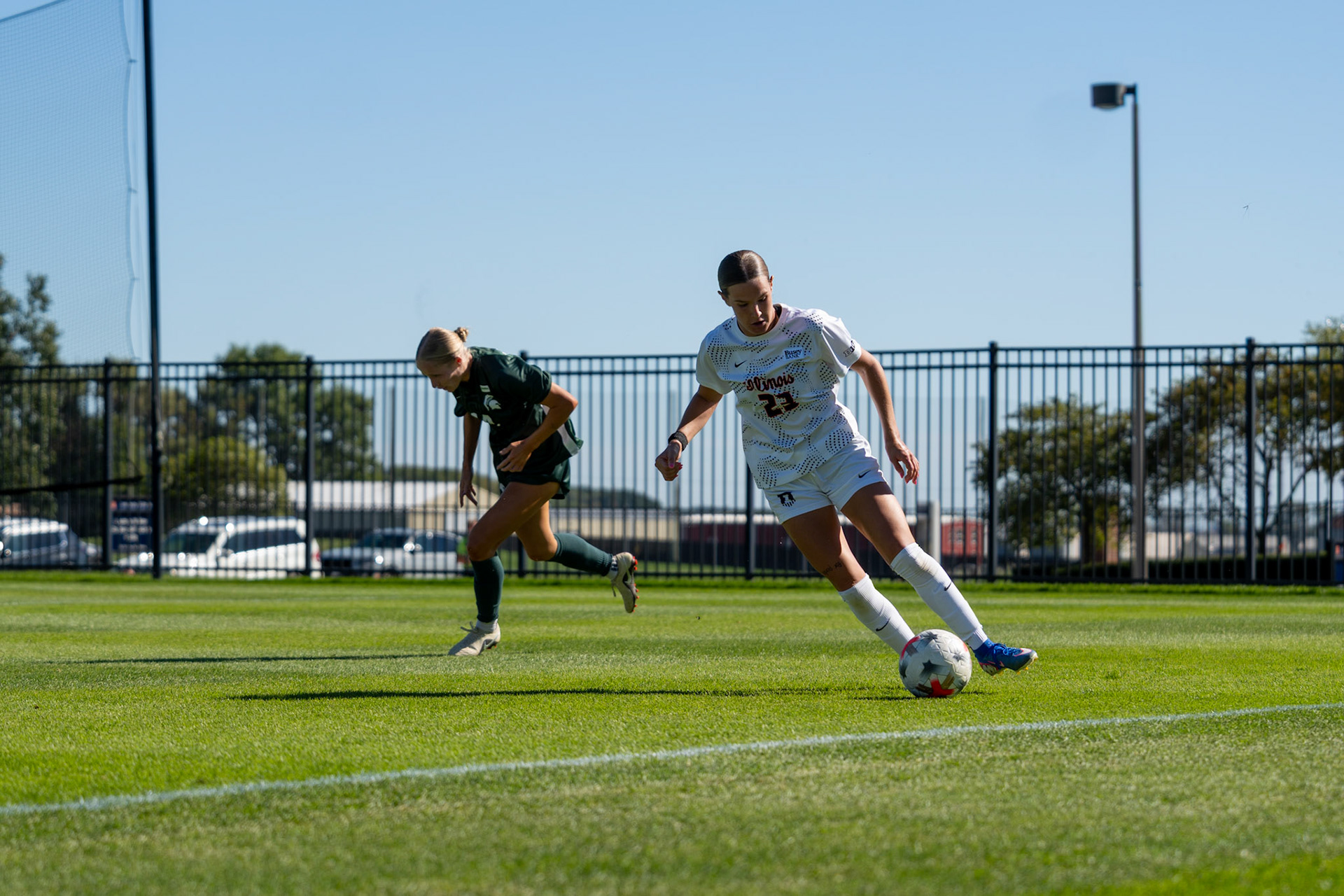 Ashlyn Adams, sophomore forward, dribbles past Michigan State defender Faith George at Demirjian Park on Oct. 4, 2026. Adams recorded three shots in Illinois' 1-0 loss to No. 2 Michigan State.
