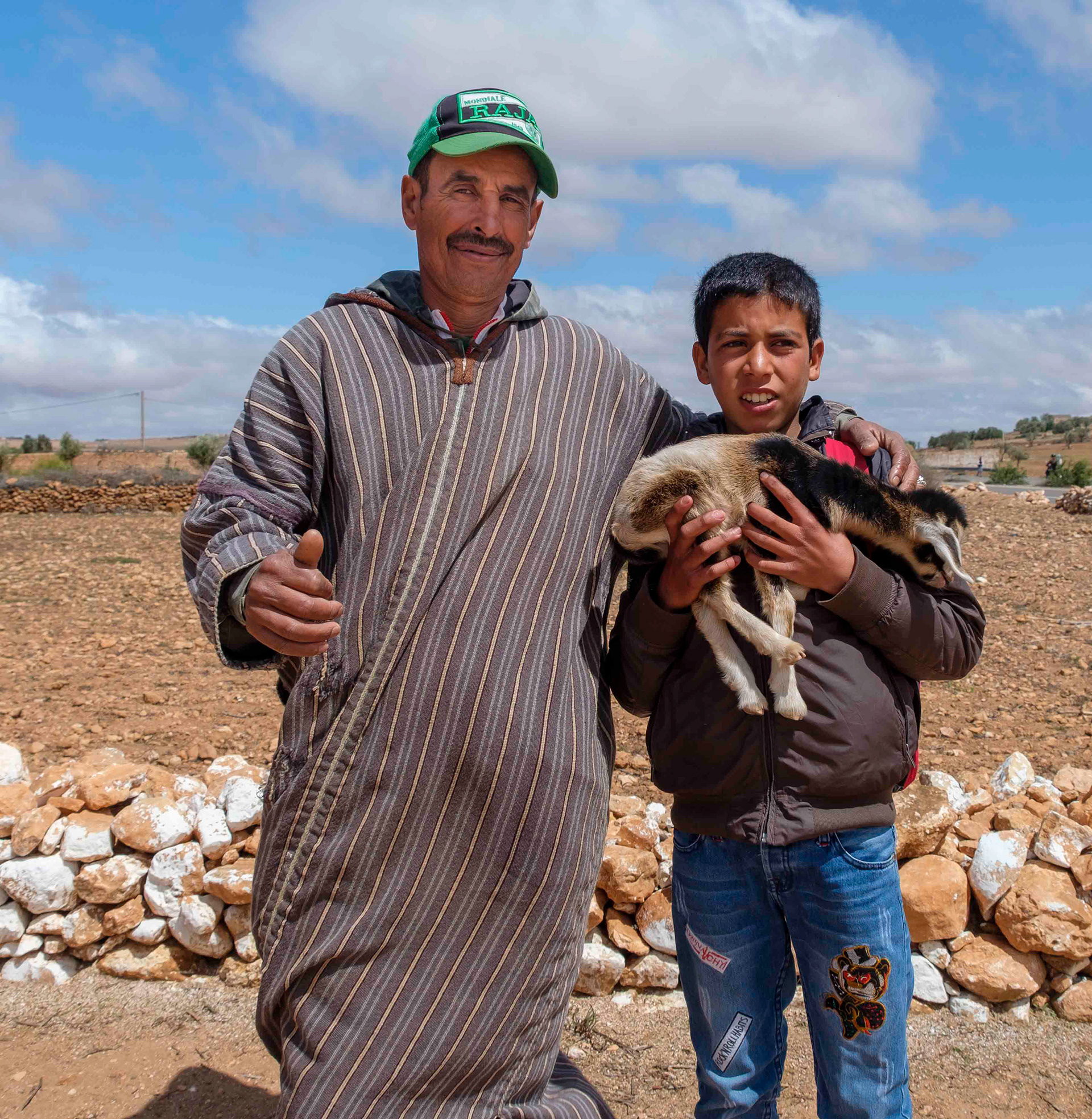 Goat herder and son