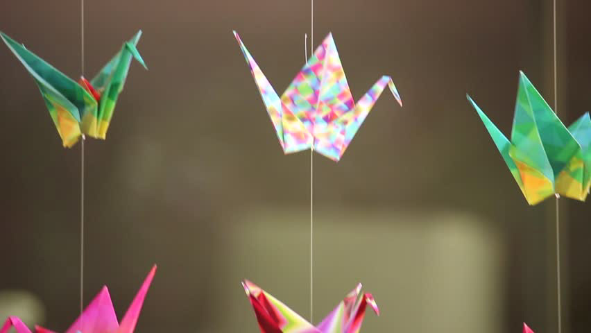 https://www.shutterstock.com/video/clip-1007818078-japanese-origami-paper-cranes-on-strings-gently