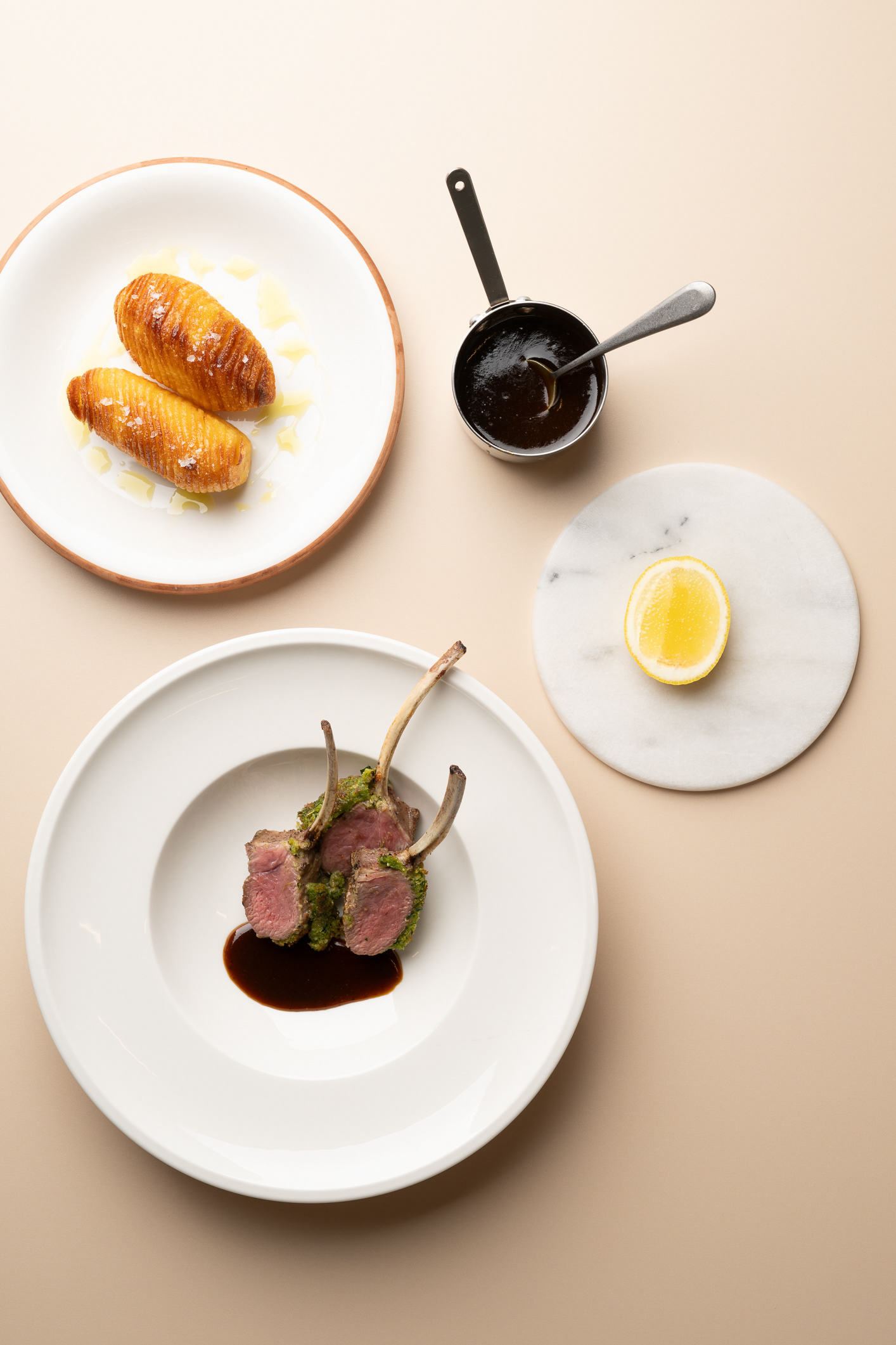 Rack of Lamb with Herb Crust, Hasselback Potatoes, and Lamb Glaze - photo Martin Kaufmann