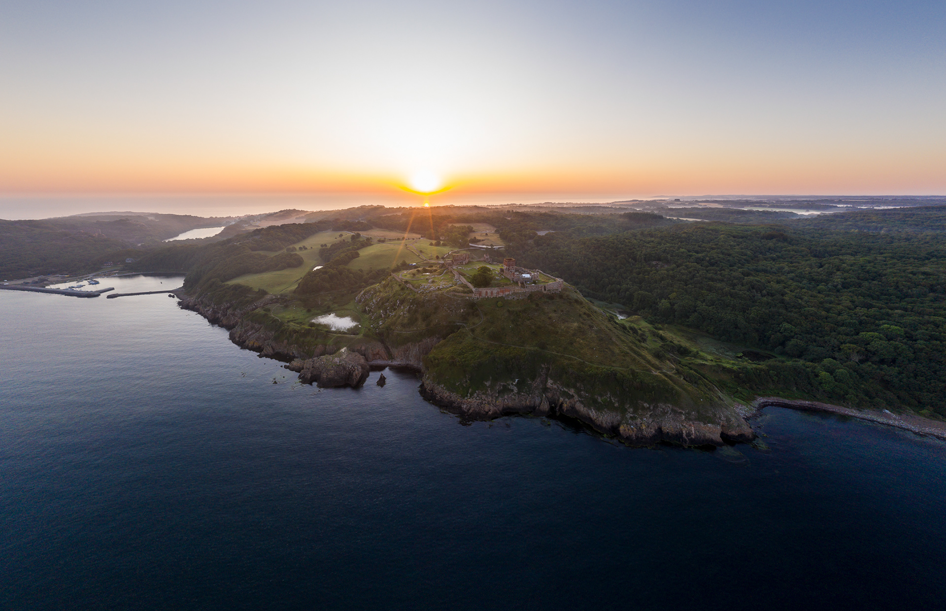 Early morning drone image of Hammershus and Hammerhavn, Bornholm, Denmark