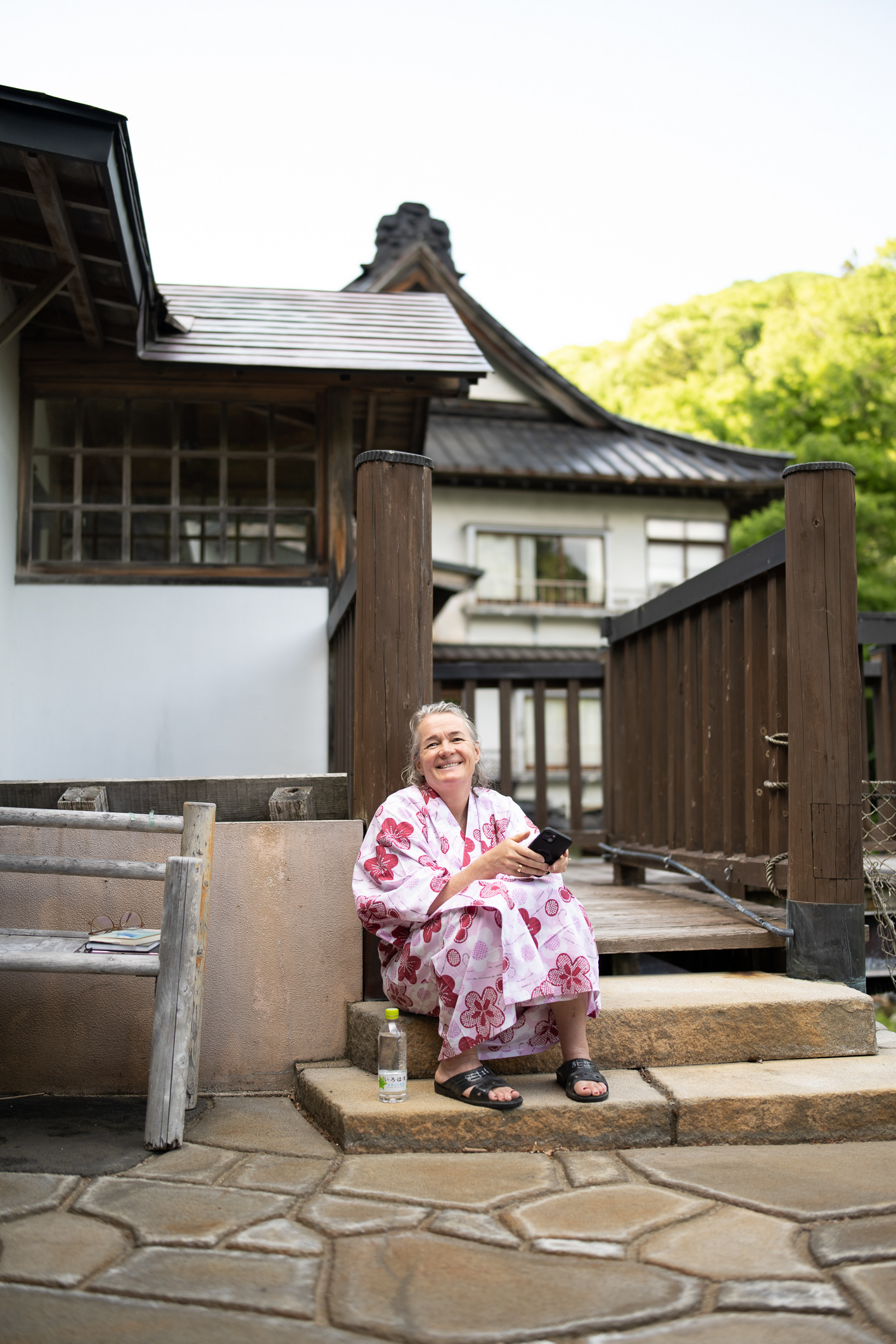 Mette waiting for me while I photograph the bridge - at Takaragawa Onsen