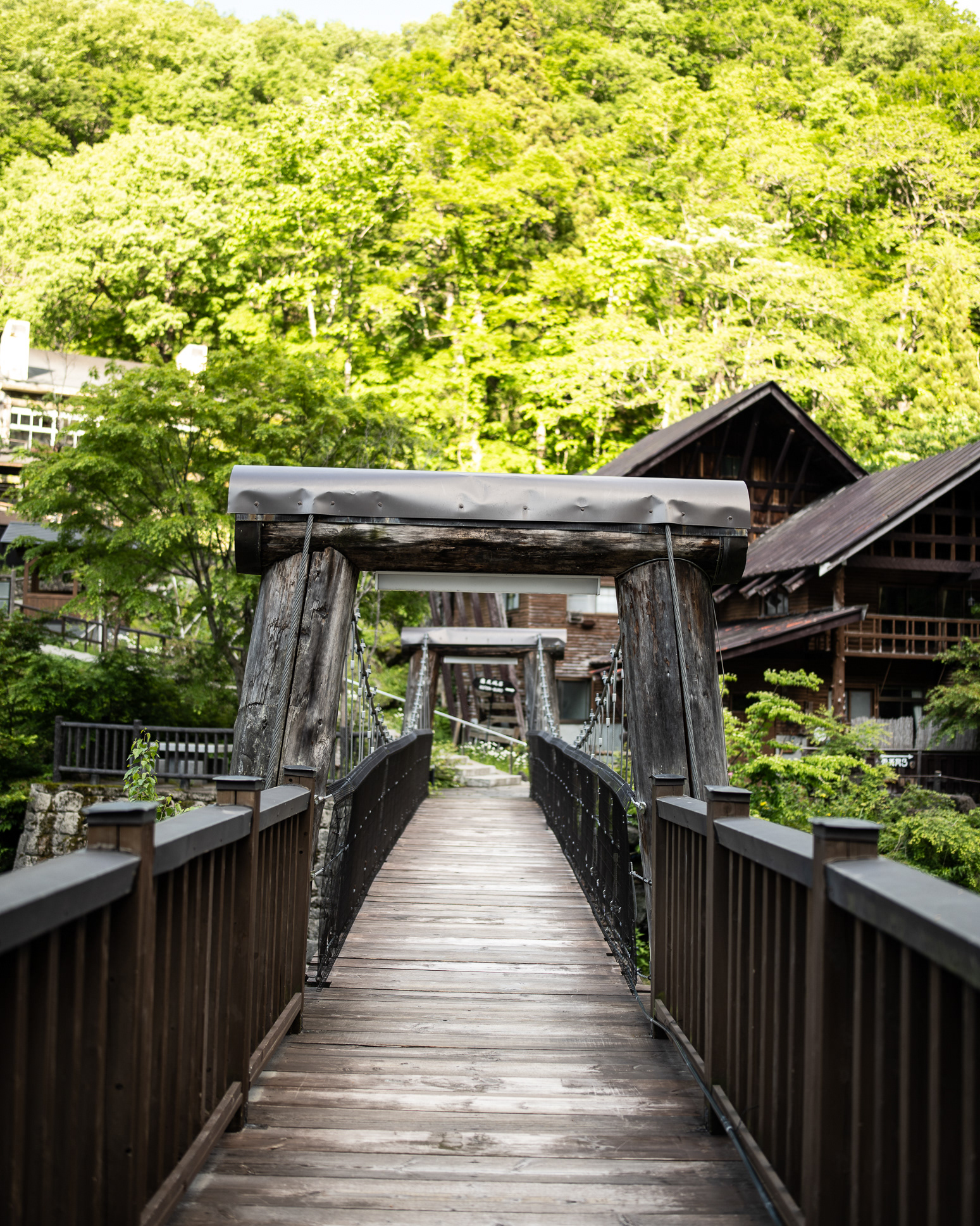 The suspension bridge at Takaragawa onsen - towards the baths - photo Martin Kaufmann