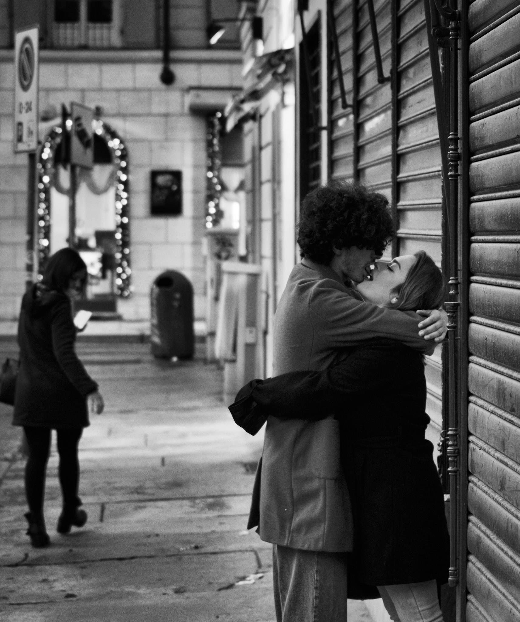 It's called "Kisses #4" because it's the fourth photo of a series where the main theme is the kiss. I took photos of kisses in Italy and I took this photo while I walked through the streets of Turin (Italy).