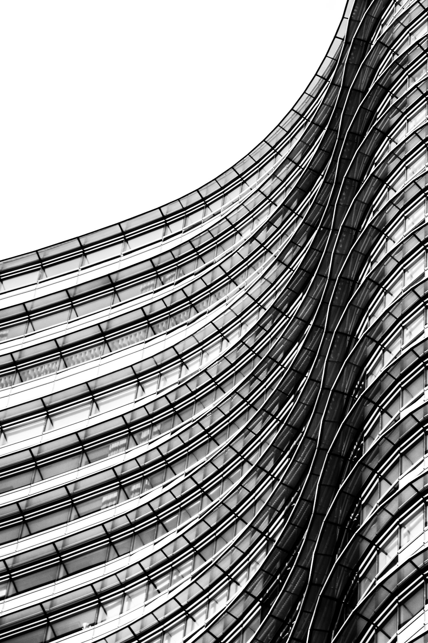 Before moving to Milan (Italy), some years ago, my photos were focused on landscapes. The city of Milan, with its new buildings, inspired me to start to take photos of architecture. But I wanted to experiment, not only take photos of buildings, so I started this series, which is a combination of architecture and abstract. It's not important which building is it, but what it conveys to the viewer.