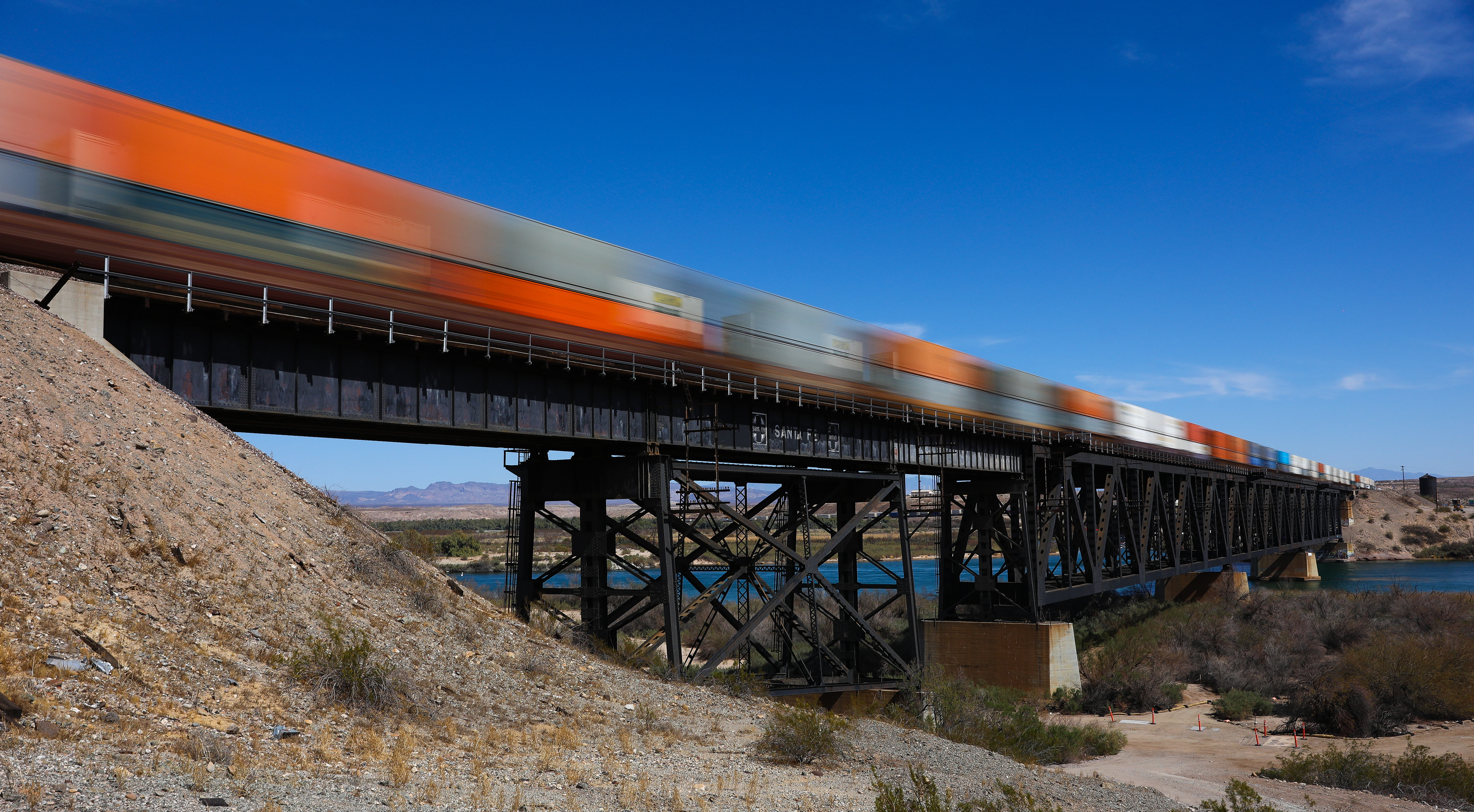 Two stacks meet at track speed on the imposing railroad bridge spanning the Colorado River at Topock. 