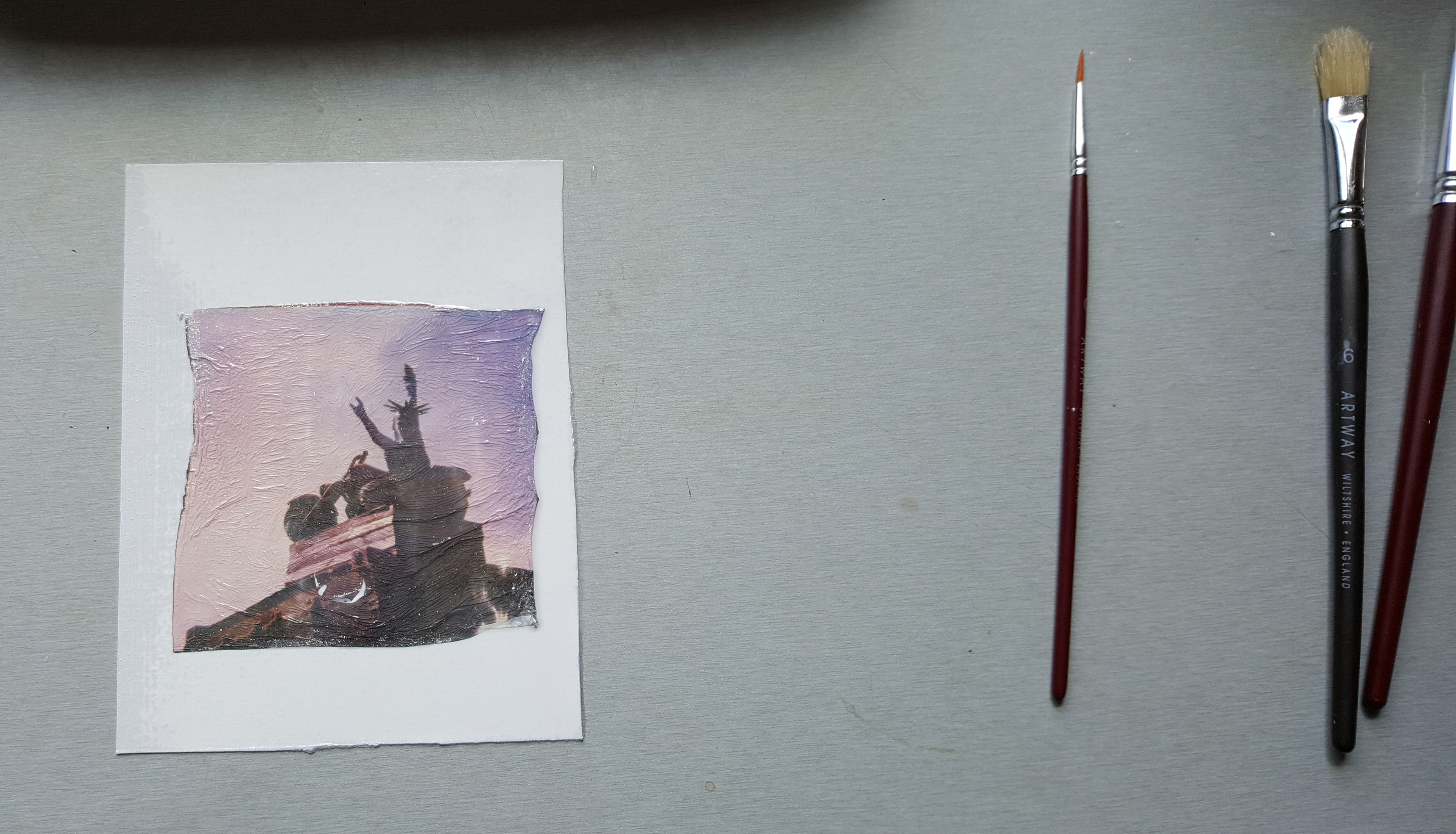 Once the film is on the paper you can gently swish the edges through the water to straighten them and using the small paint brush, this is where you get creative, you can either complete the image by gently manipulating the edges and adding creases to the image, repairing rips and tears because you will get them, or just straightening everything out. Blot off any excess water and leave to dry on some paper towel.  Lastly don't forget to TIDY UP. Put everything in the bin, wipe the surfaces down and wash the dish and your hands well, then go check on your newest creation.