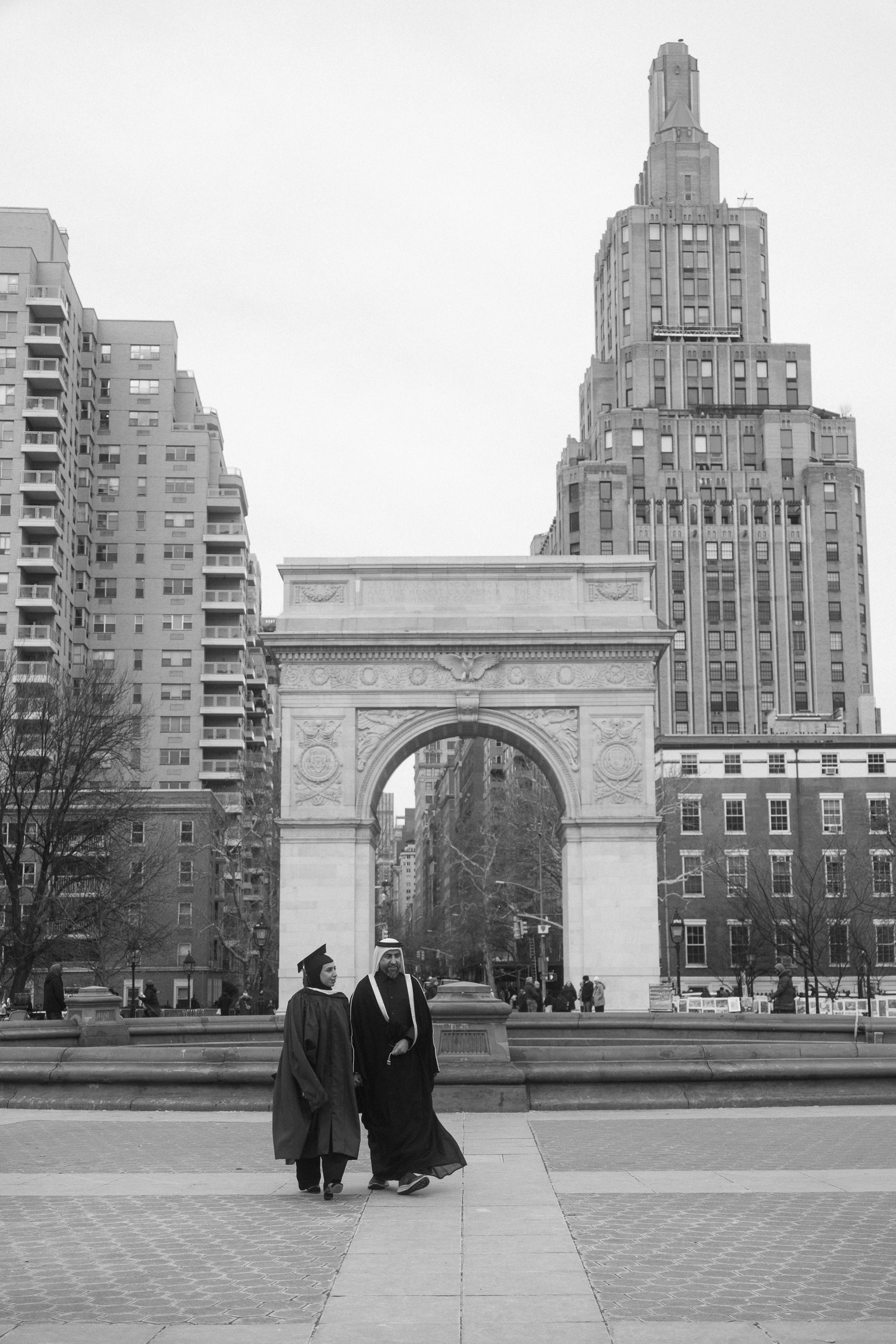 Authentic graduation session in New York City featuring NYU graduate celebrating academic milestone