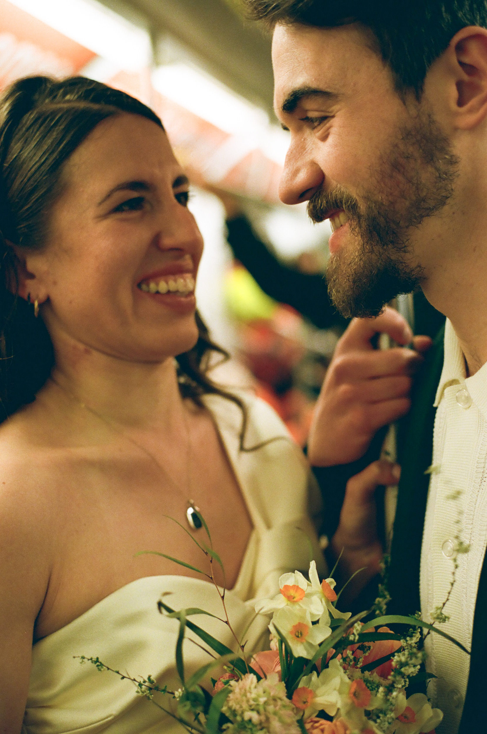 Couple riding the NYC subway after an elopement