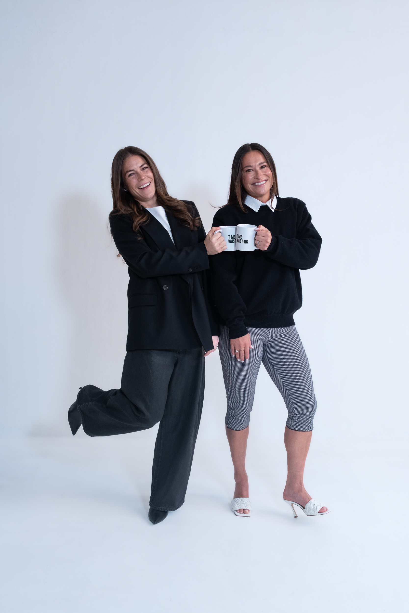 Kelley O’Hara and Ali Riley in a studio session for their new podcast Time Wating