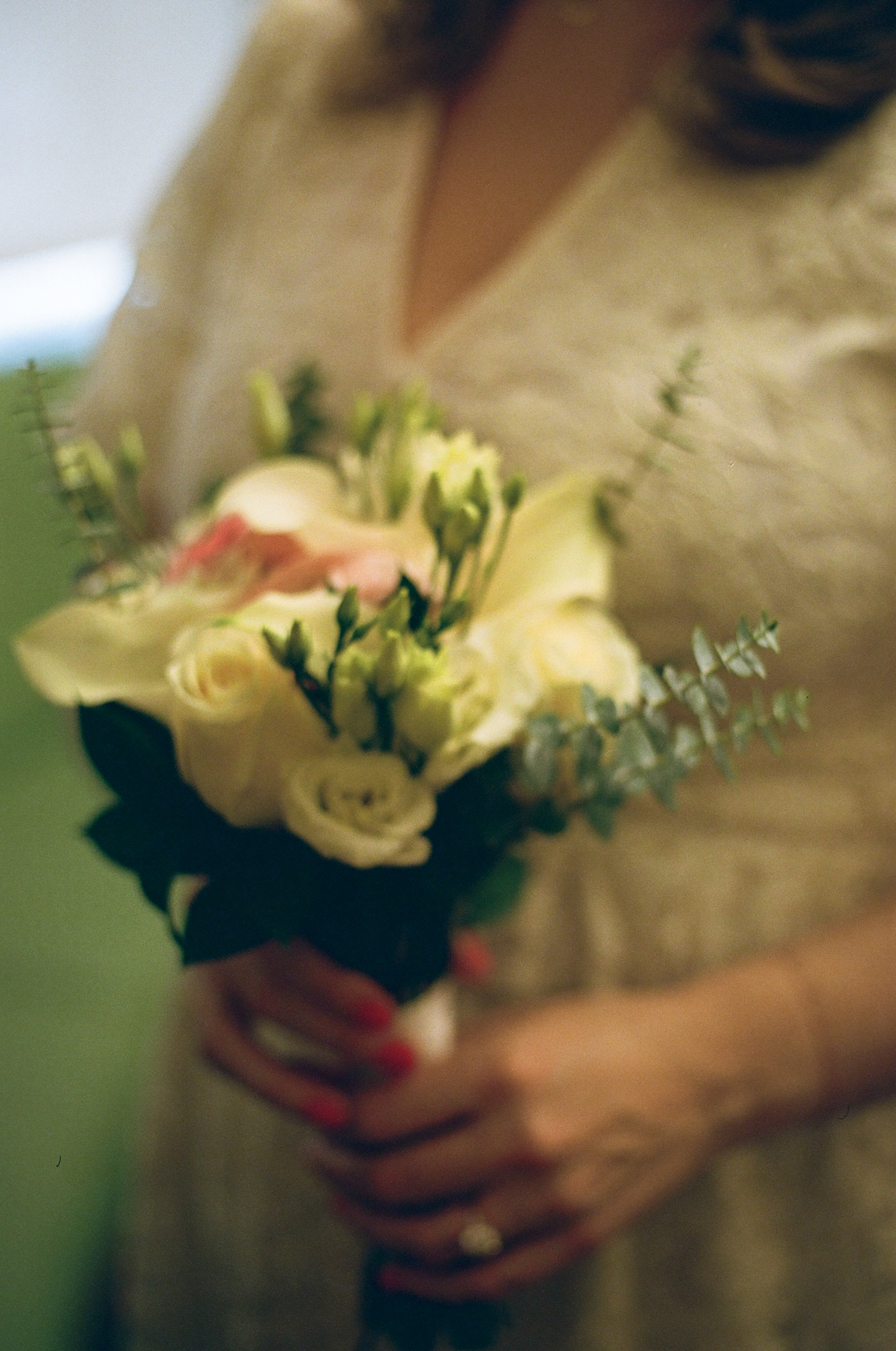 35mm film photo of a bride holding flowers