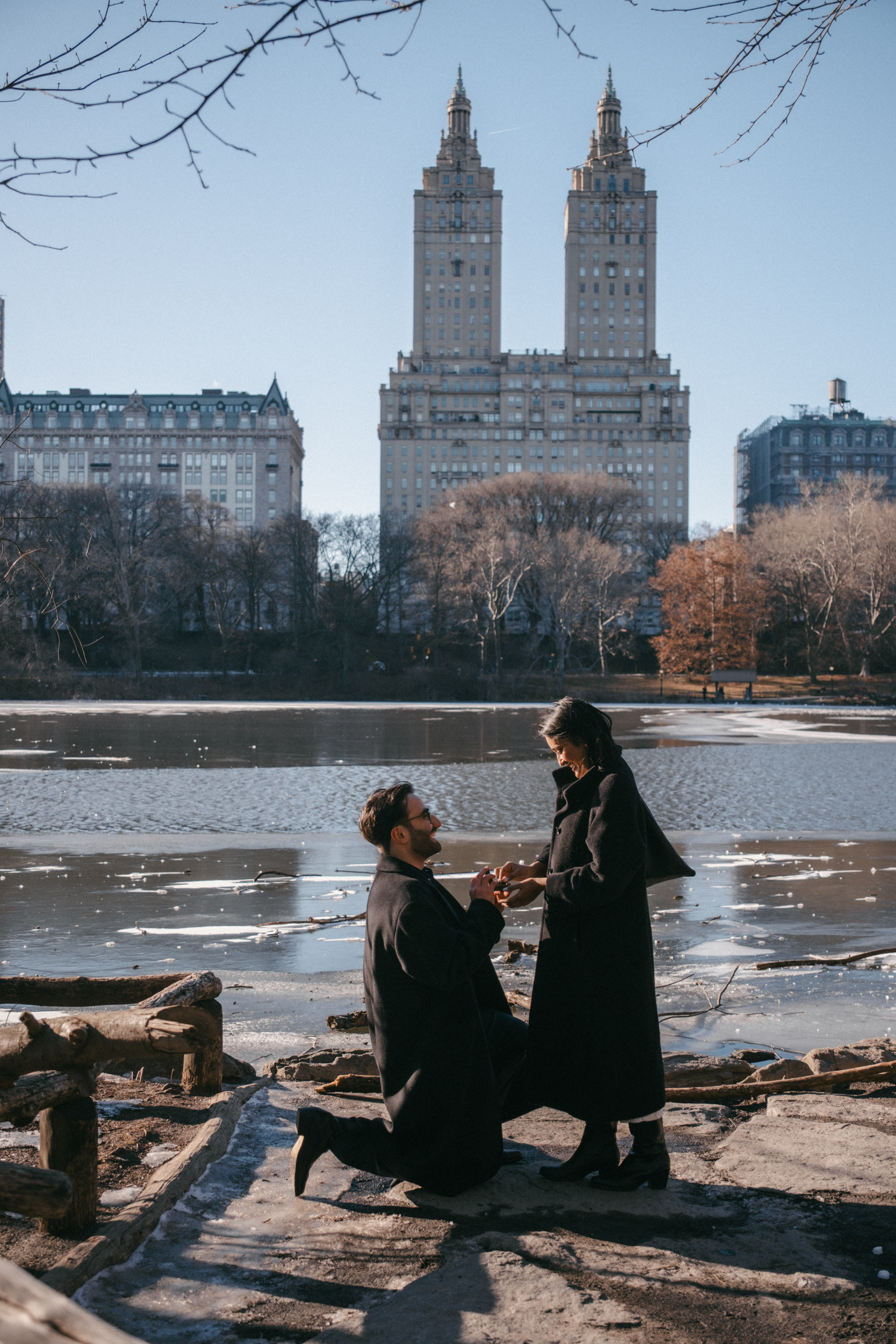 Documentary style photo of a couple during a proposal in Central Park