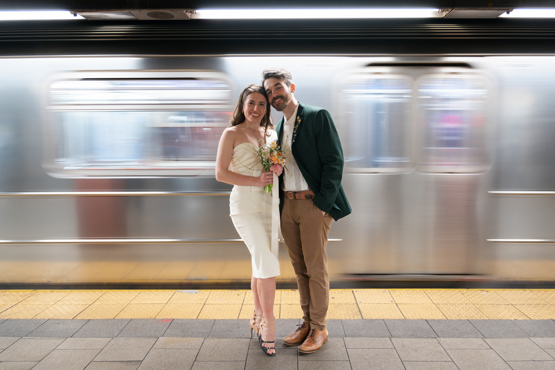 Portrait of a couple at the NYC Subway after an elopement