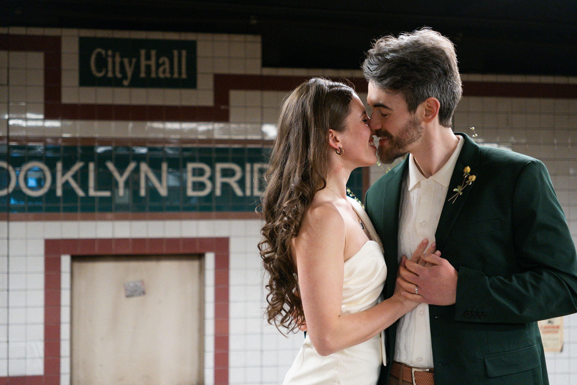 Portrait of a couple after a city hall wedding at the NYC subway station City Hall Brooklyn Bridge