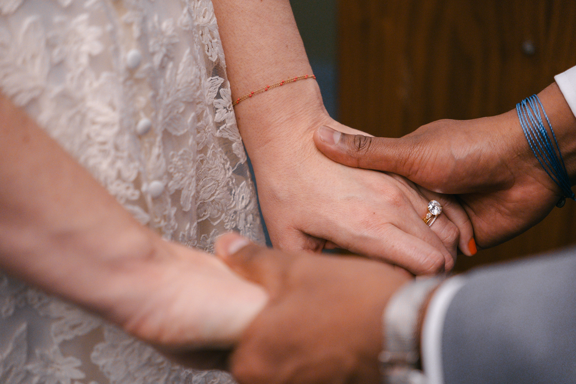 Couple holding hands during a City Hall wedding ceremony