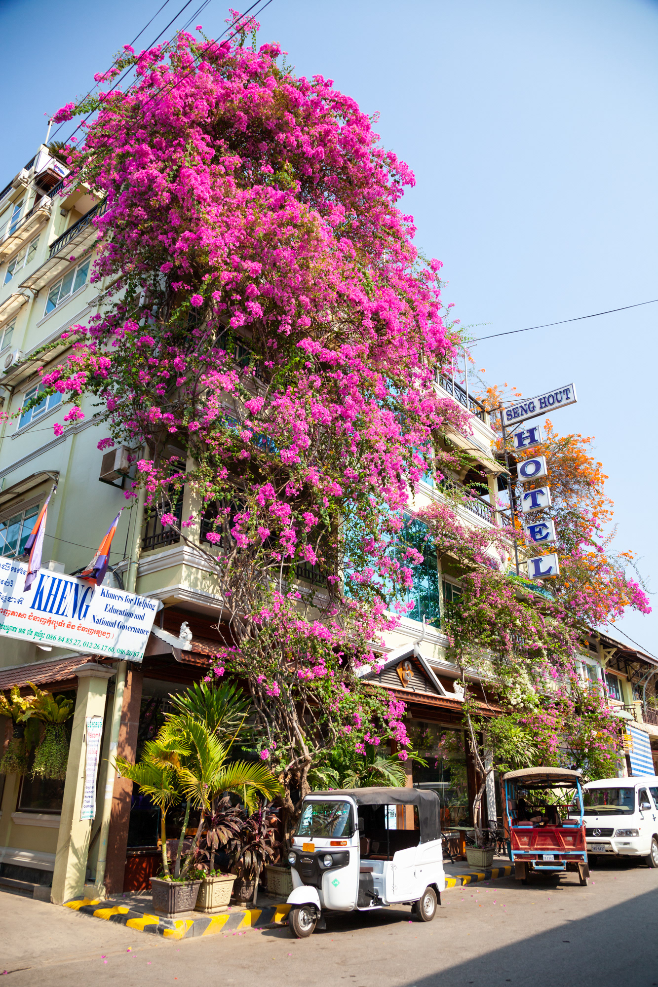 Our faithful tuk tuk parked outside the colourful Seng Hout Hotel in Battambang, a very nice, very old establishment featuring a very decent rooftop bar!