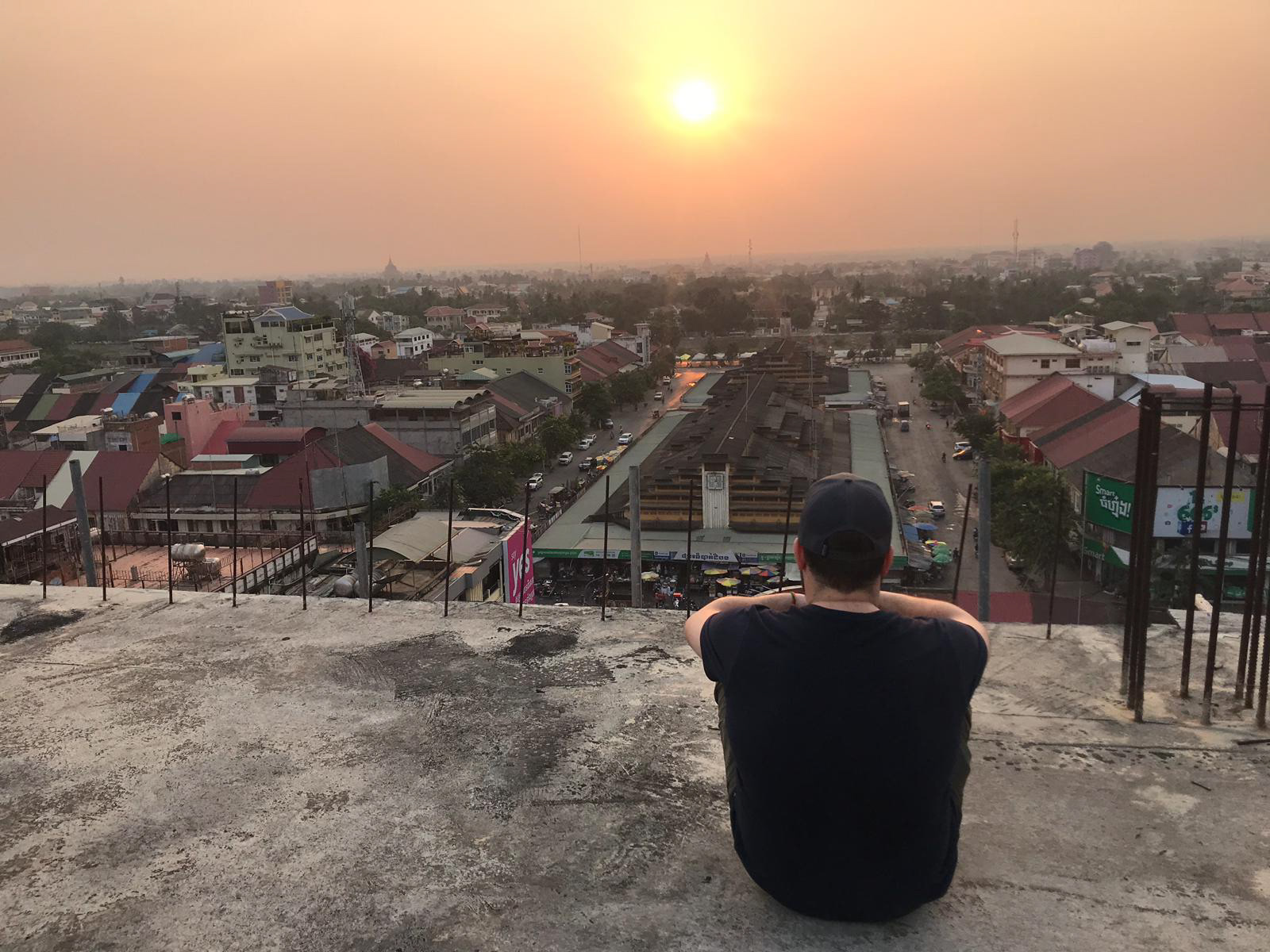 Dillon enjoying the early morning sights, sounds and smells as the sun rises over Battambang.