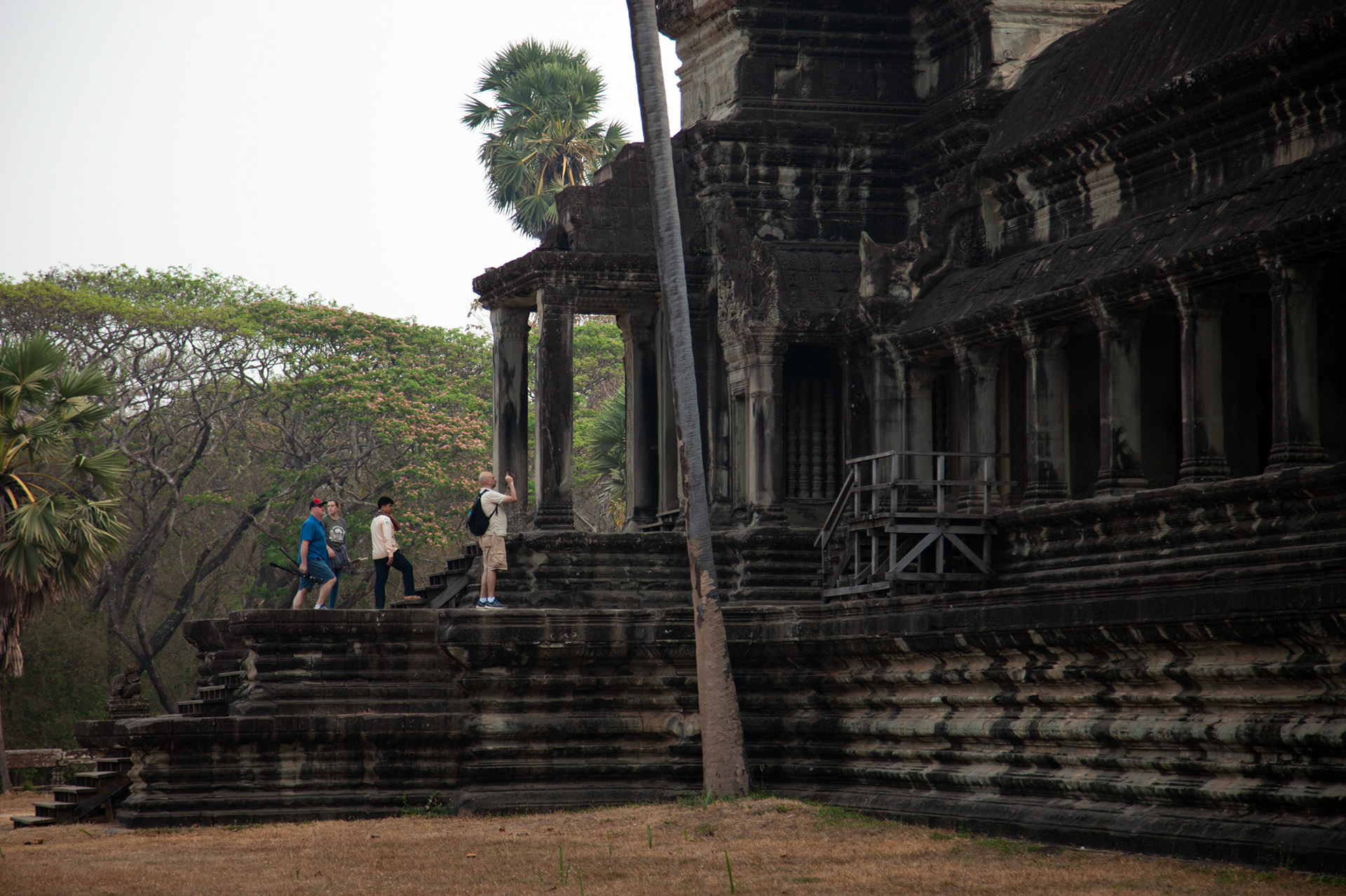 Mounir, Claus, Haley and our Khmer guide exploring the main temple complex of Angkor Wat.