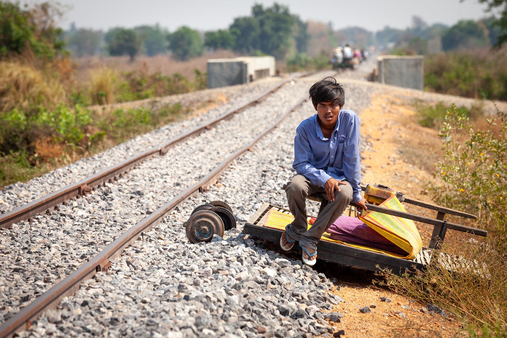 Our bamboo railroad conductor patiently waits for traffic to pass on the busy tracks. This wasn't the only time we were forced from the railway, once it was to avoid a massive freight engine, and another because Claus managed to crash it…