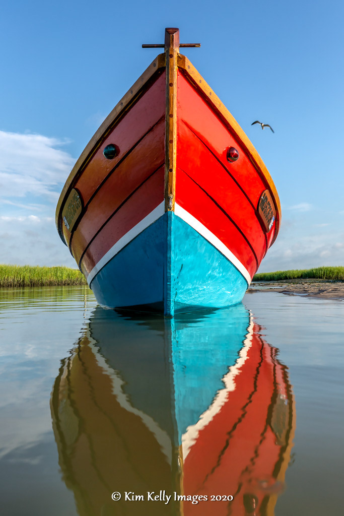 Wooden Hulled Dinghy Reflected