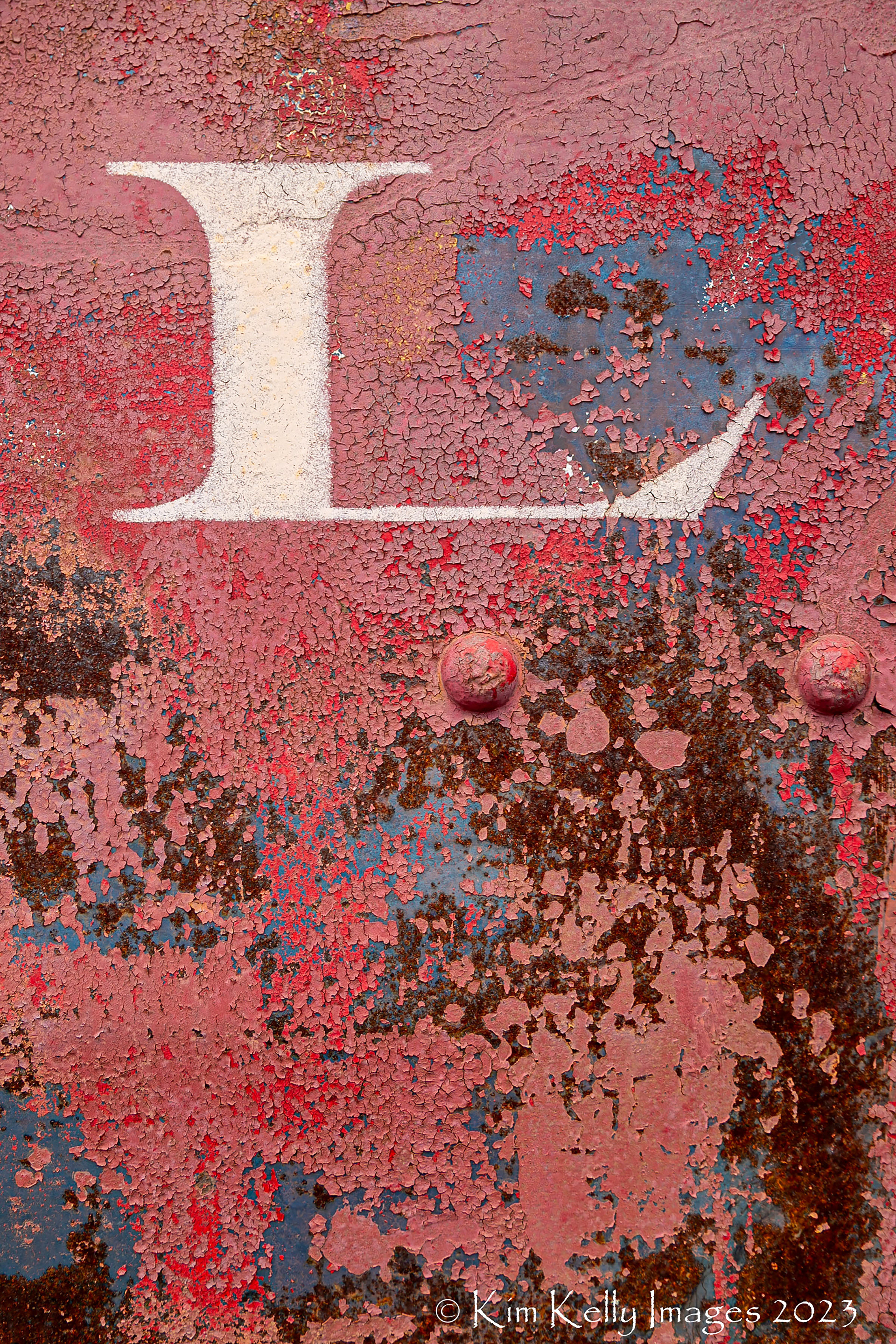 L on a Rusty Train Car