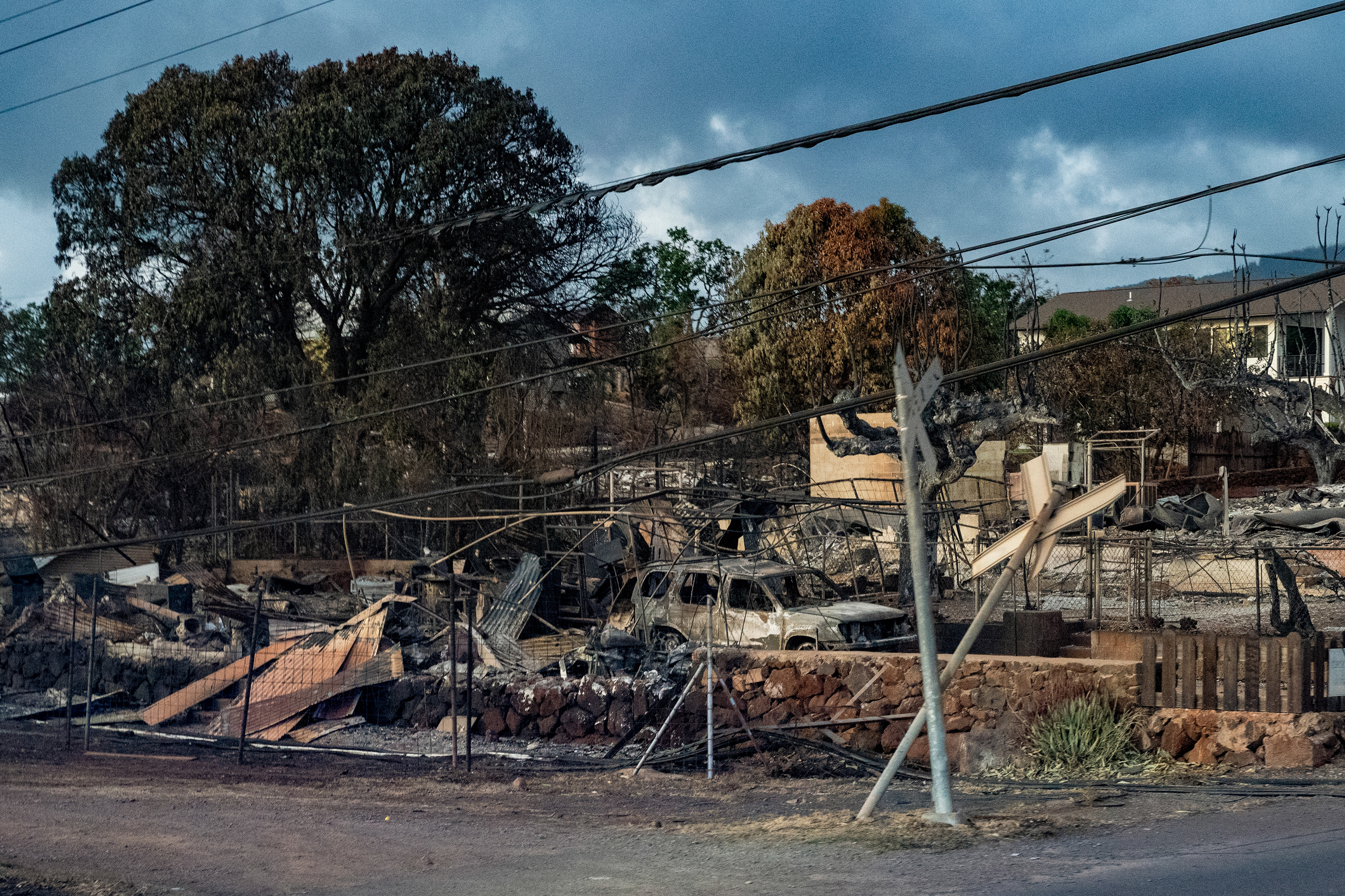 Lahaina, HI - AUGUST 23: Cars and houses are burned down causing by the wildfire on Honoapiilani Highway in Lahaina, Hawaii on August 10, 2023. (Photo by Mengshin Lin for The Washington Post)