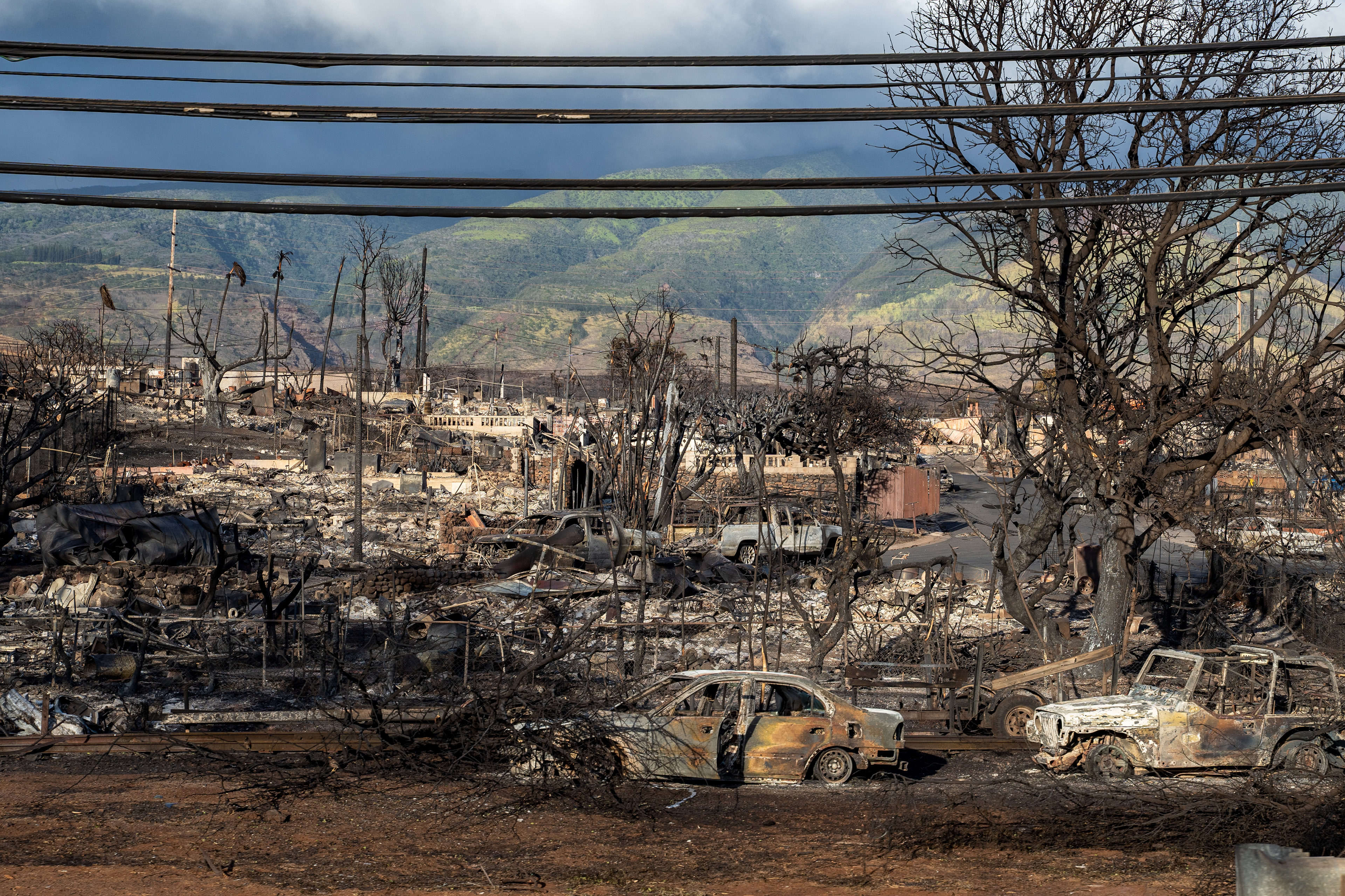 Lahaina, HI - AUGUST 23: Cars and houses are burned down causing by the wildfire on Honoapiilani Highway in Lahaina, Hawaii on August 10, 2023. (Photo by Mengshin Lin for The Washington Post)