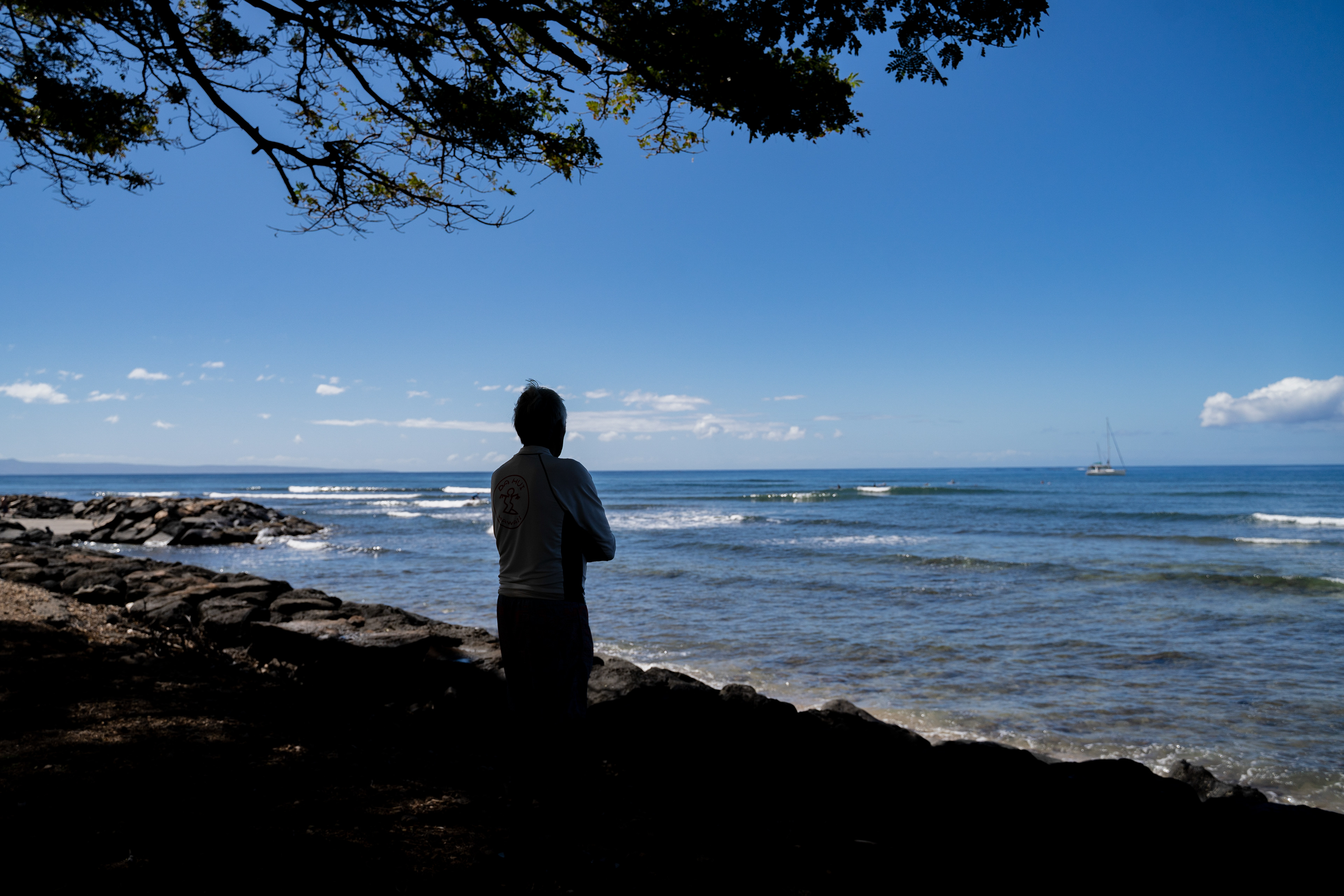 Abraham “Snake” Ah Hee, one of the first crew members of Hokulea - the Polynesian double-hulled voyaging canoe, looks at the ocean at Launipoko Beach Park on Friday, Feb. 23, 2024, in Lahaina, Hawaii. (AP Photo/Mengshin Lin)
