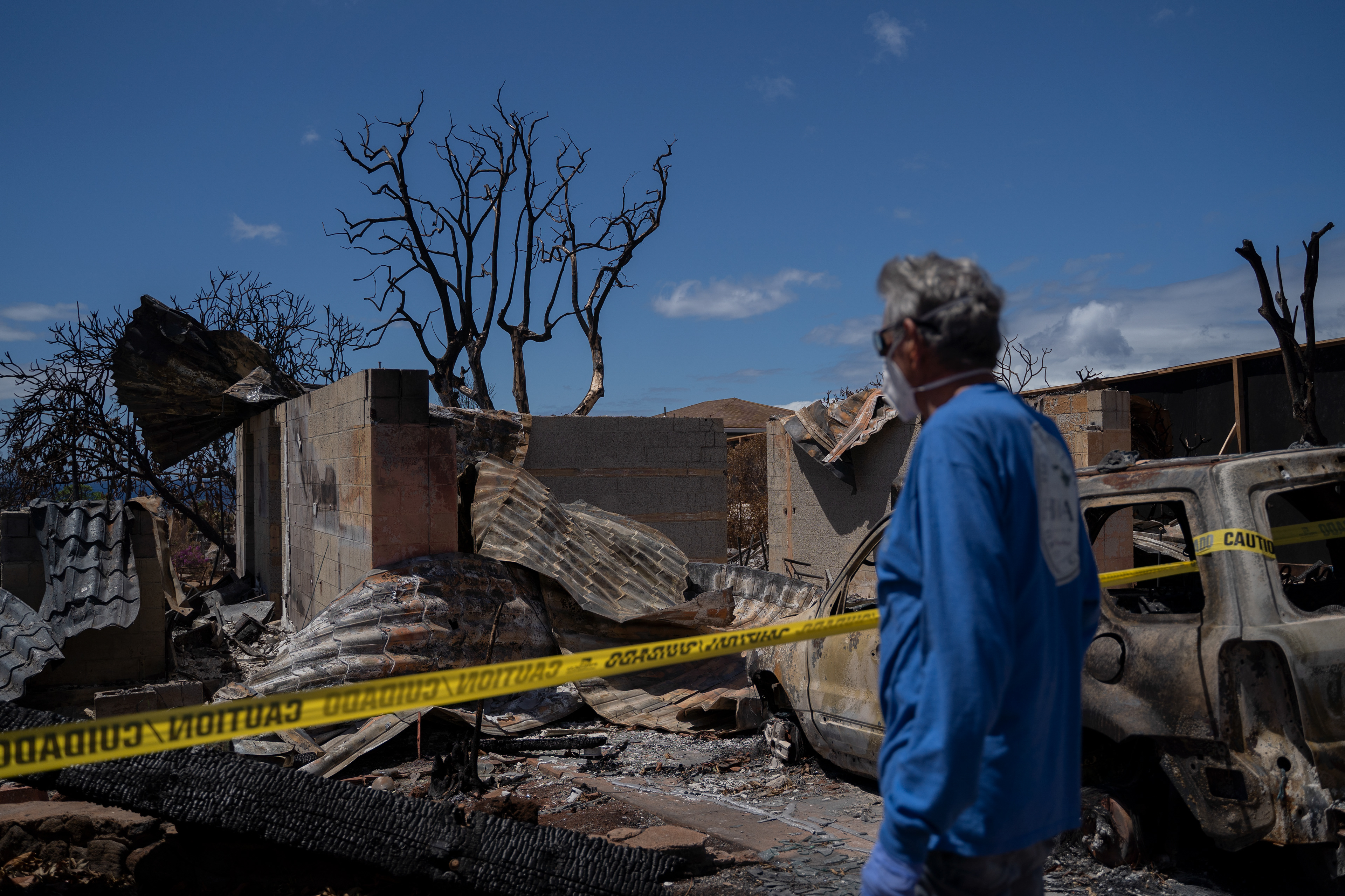 Michael Vierra looks at his house for the first time after the wildfire in August, on Tuesday, Sept. 26, 2023, in Lahaina, Hawaii. (AP Photo/Mengshin Lin)  