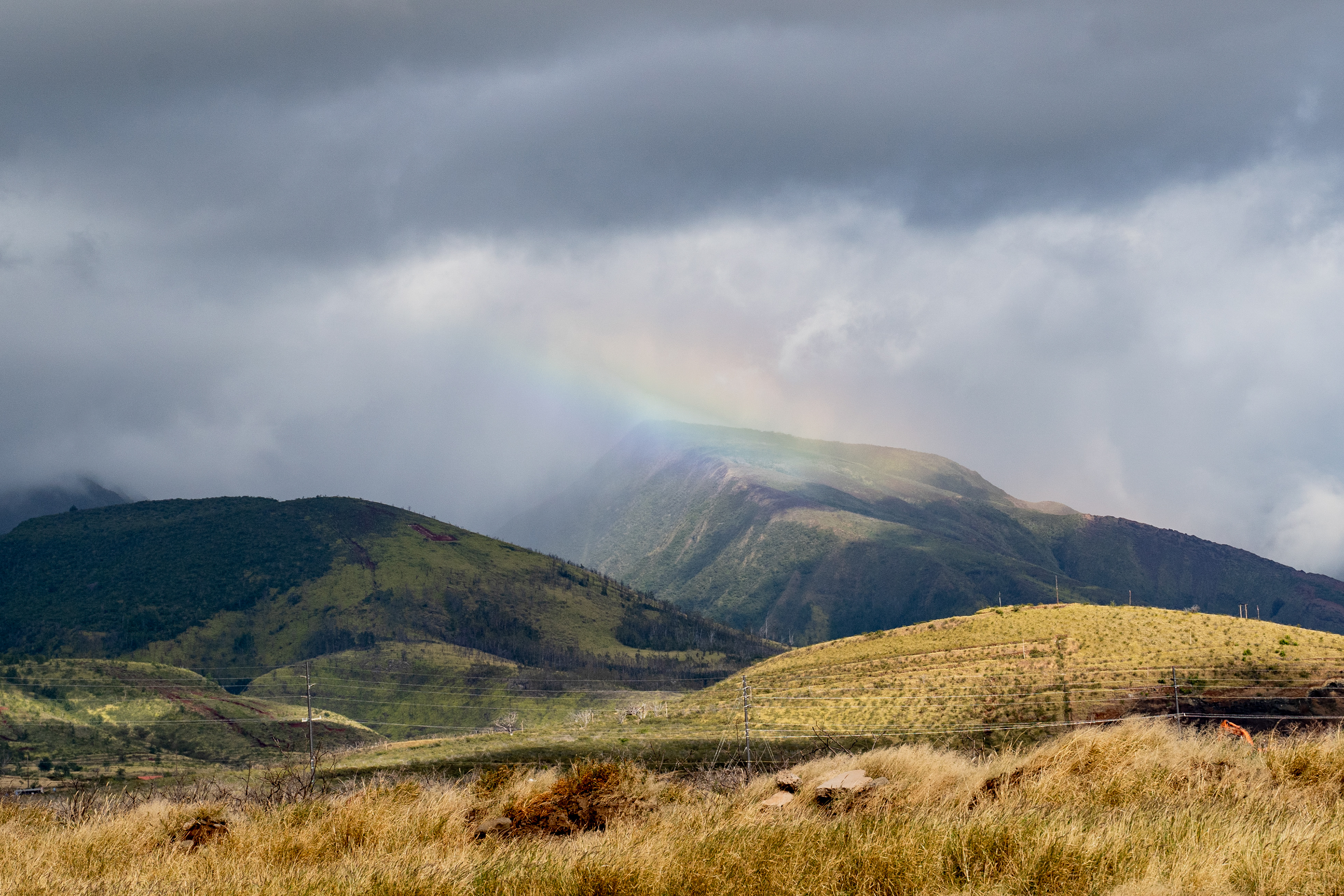 LAHAINA, HI - MAY 24: A rainbow appear between the hills overlooking Lahaina town in Lahaina, Hawaii on Thursday, May 2, 2024. (Photo by Mengshin Lin for The Washington Post)