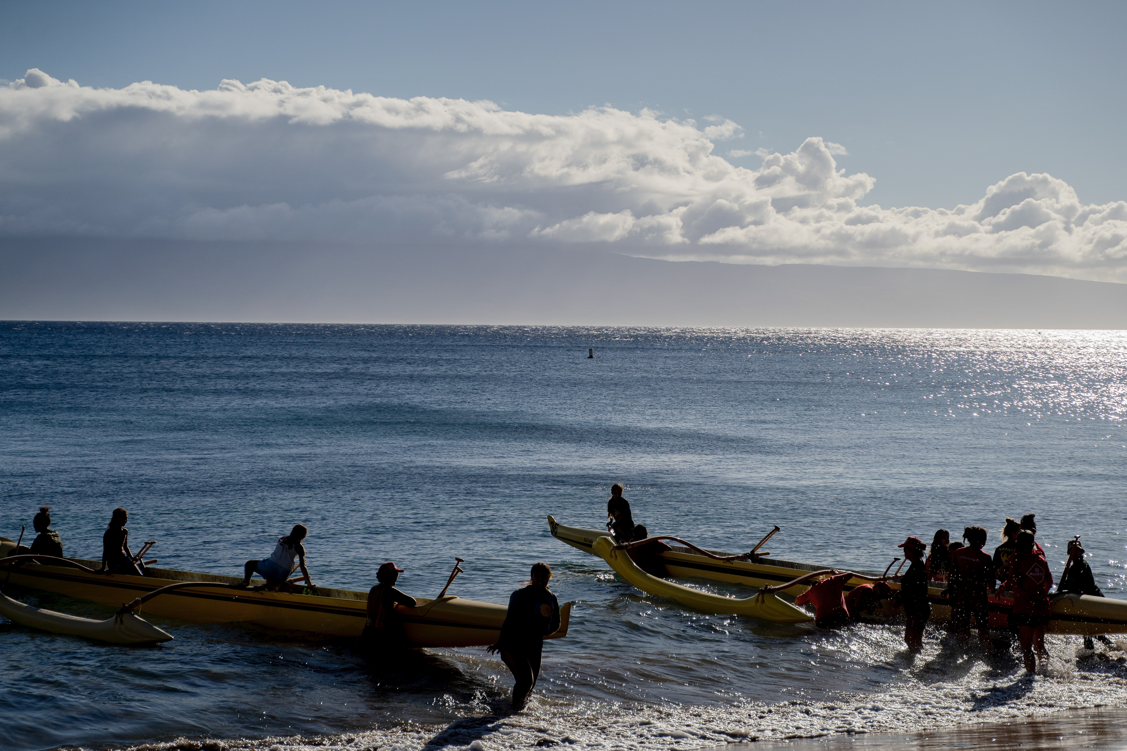 LAHAINA, HI - SEPTEMBER 8: Members of Napili Canoe Club prepare for a memorial paddle out on the one-month anniversary of the Lahaina Fire at Hanakaoo Park in Lahaina, Hawaii on September 8, 2023. (Photo by Mengshin Lin for The Washington Post)