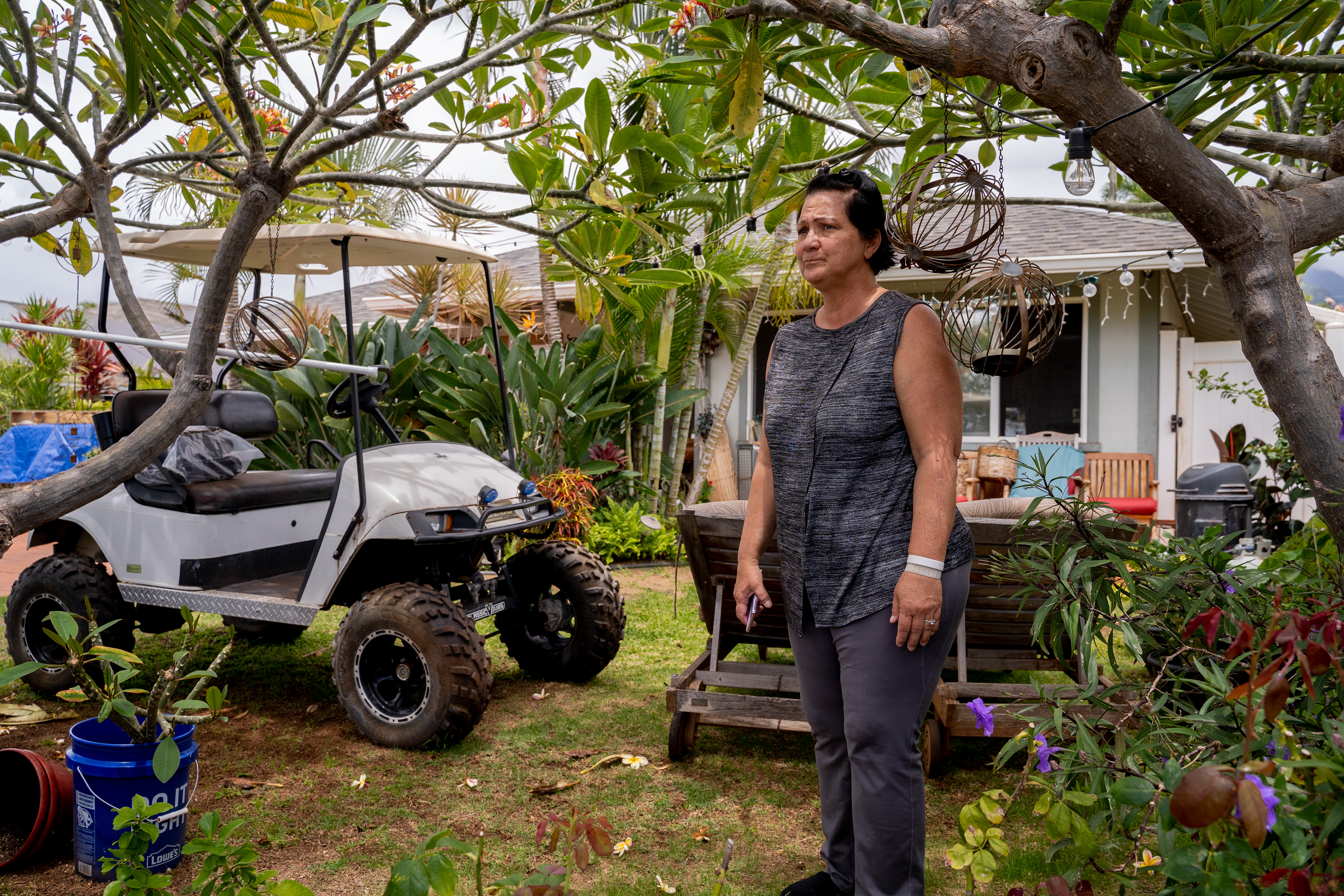 LAHAINA, HI - MAY 24: Emily Archangel is pictured during an interview at her home in Lahaina, Hawaii on Thursday, May 2, 2024. Last year’s wildfire damaged Archangel’s home, and she is concerned that the air quality and debris could impact her husband’s health condition. (Photo by Mengshin Lin for The Washington Post)