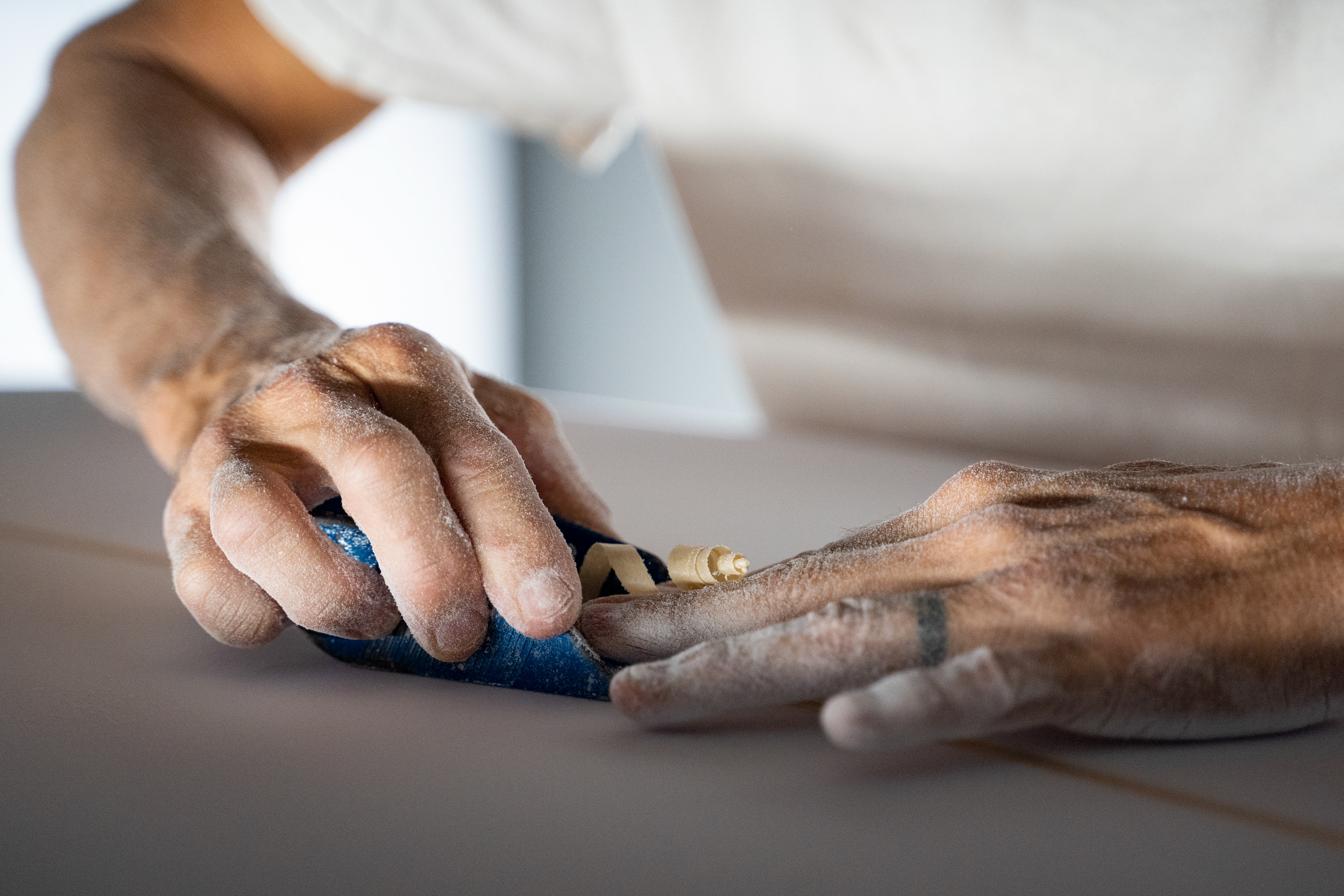 Haiku, HI - AUGUST 28: Surfboard shaper Jud Lau shapes a board at his studio in Haiku, Hawaii on August 28, 2023. Lau starts a surfboard replacement project and has given over a hundred surfboards to surfers who lost their board during the wildfire. (Photo by Mengshin Lin for The Washington Post)