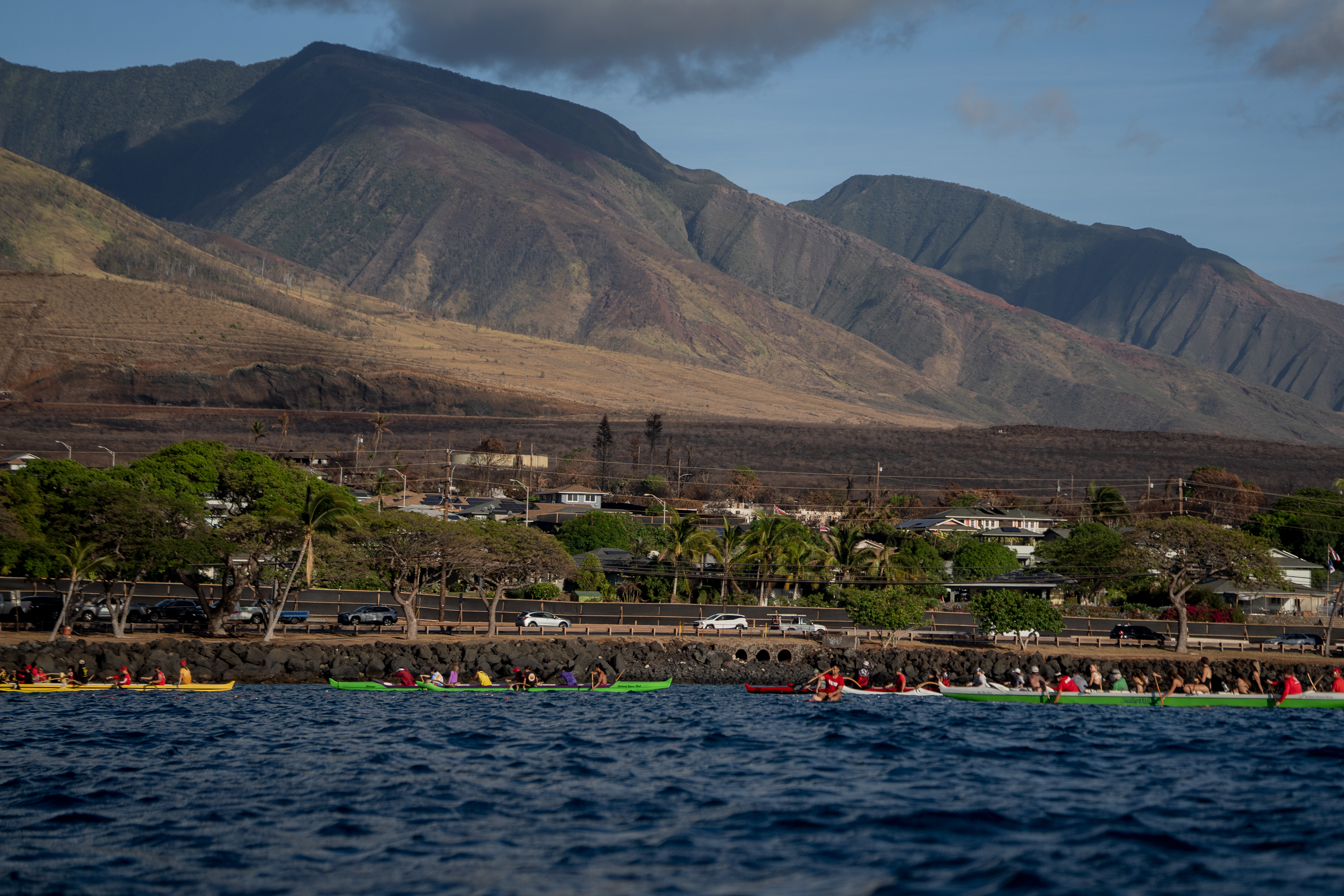 LAHAINA, HI - SEPTEMBER 8: Canoes from Napili Cane Club, Kahana Canoe Club and Lahaina Canoe Club are pictured for a memorial paddle out on the one-month anniversary of the Lahaina Fire at Hanakaoo Park in Lahaina, Hawaii on September 8, 2023. (Photo by Mengshin Lin for The Washington Post)