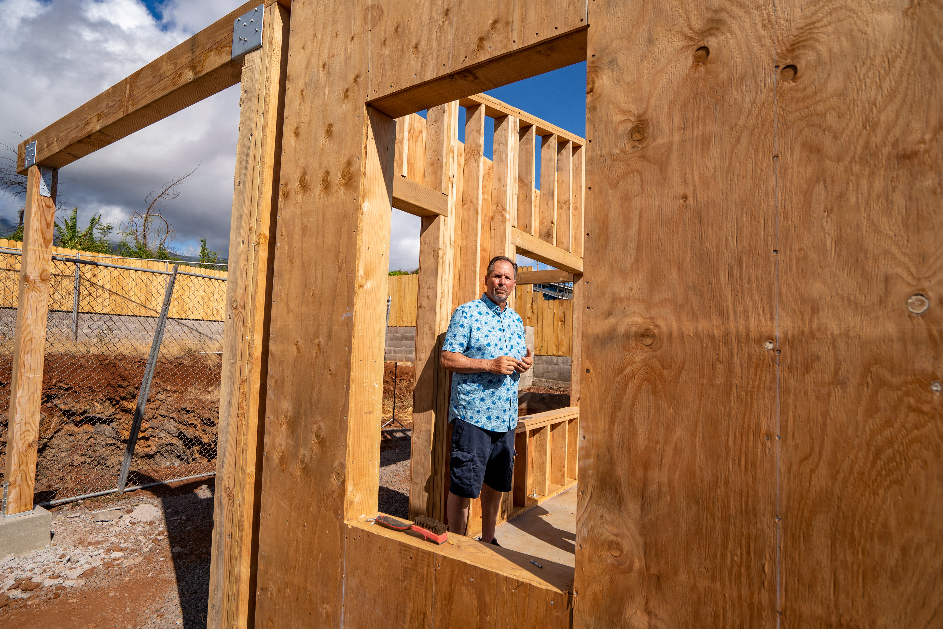 Gene Milne, an impact zone property owner, is pictured during an interview on Wednesday, June 26, 2024, in Lahaina, Hawaii. Milne lost his newly build home from last year’s wildfire is the first property owner to start the rebuild process as his building permit cases was being reviewed during the wildfire. (AP Photo/Mengshin Lin)