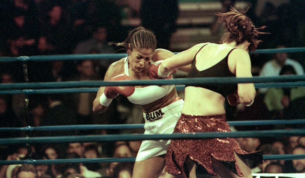Auburn Hills, Mi; Oct 20, 2000. Leila Ali v Kendra Lenhart. Leila Ali is caught by a straight leftt jab from Lenhart. However, Ali won the bout with a unanimous decision. Watching riingside her father Muhammad Ali.