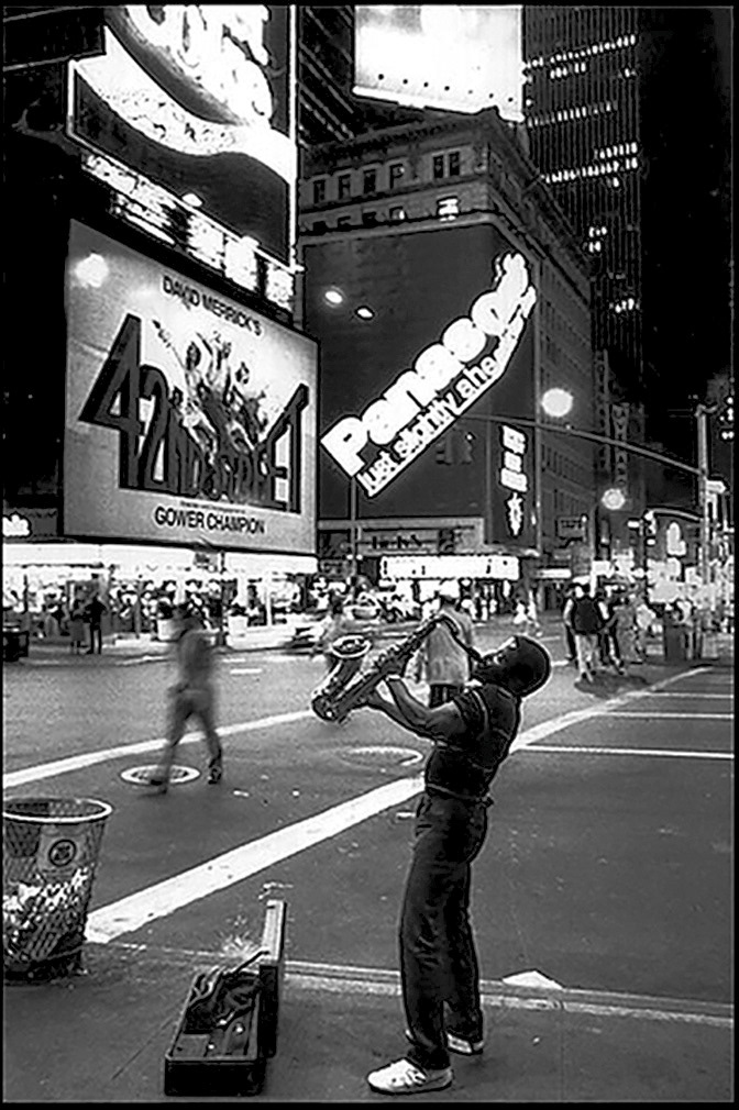 New York City, 1980's a street musician performing in Times Square.