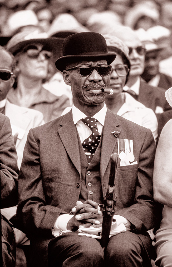 Kingston, Jamaica. Feb 18, 1974. A well dressed gentleman awaits the arrival of Her Majesty Queen Elizabeth.