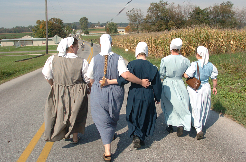 Nickel Mines, Pa; Oc t; 2006. Amish women walk to a nearby school house, the scene of a deadly shooting.