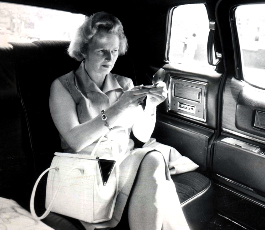 Washington DC. Sept 27, 1976. After accepting the title of Leader of Britain's Conservative Party Margaret Thatcher headed to Washington DC. Seated in a stretched limo Mrs. Thatcher checked on her appearance.