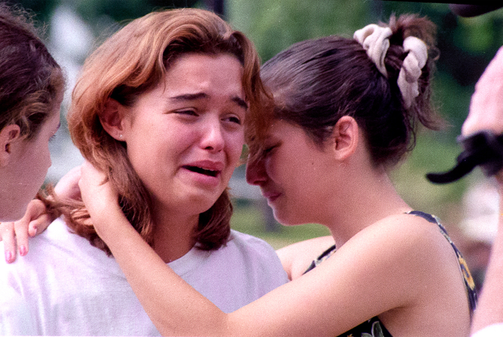 Montoursville, Pa; July 18, 1996. Two students at Montoursville High School comfort each other upon learning of their school friends who died in the crash of TWA 800 off the coast of Long Island.