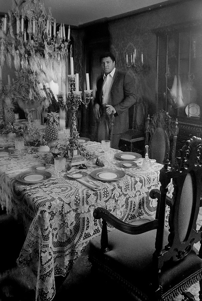 Muhammad Ali stands amid his own opulence at home in Fremont Place, Los Angeles. Feb 23, 1983