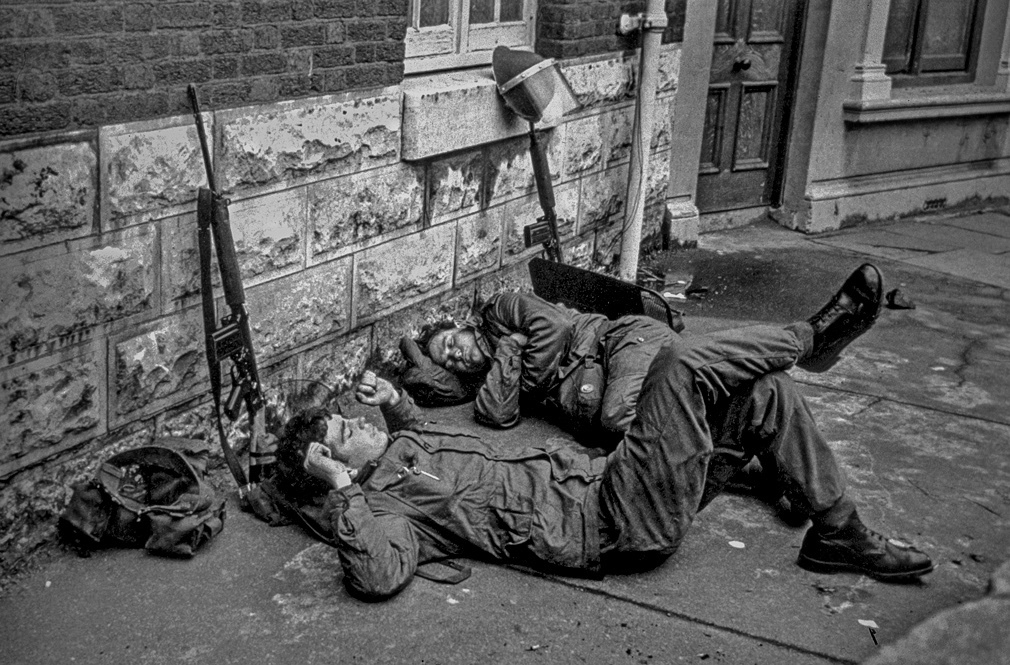 Belfast, N. Ireland. Saturday July 4, 1970. After maintaining a curfew in and around the Lower Falls Road British soldiers sleep on the pavement of The Falls near Leeson Street.