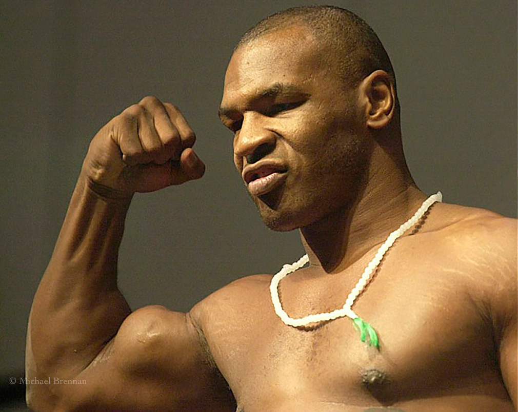 Memphis, Tn; June 7, 2002. Mike Tyson flexes his right arm muscle as he weigh's in for his fight against Lennox Lewis.